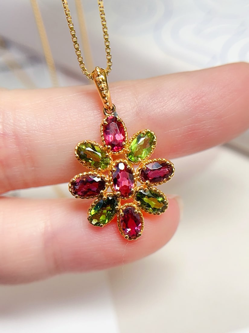 18K Gold Tourmaline Pendant: Title: 18K Gold Tourmaline Pendant Description: This pendant is meticulously crafted in 18K gold, showcasing the natural allure of tourmaline. The flawless tourmaline sparkles brilliantly under