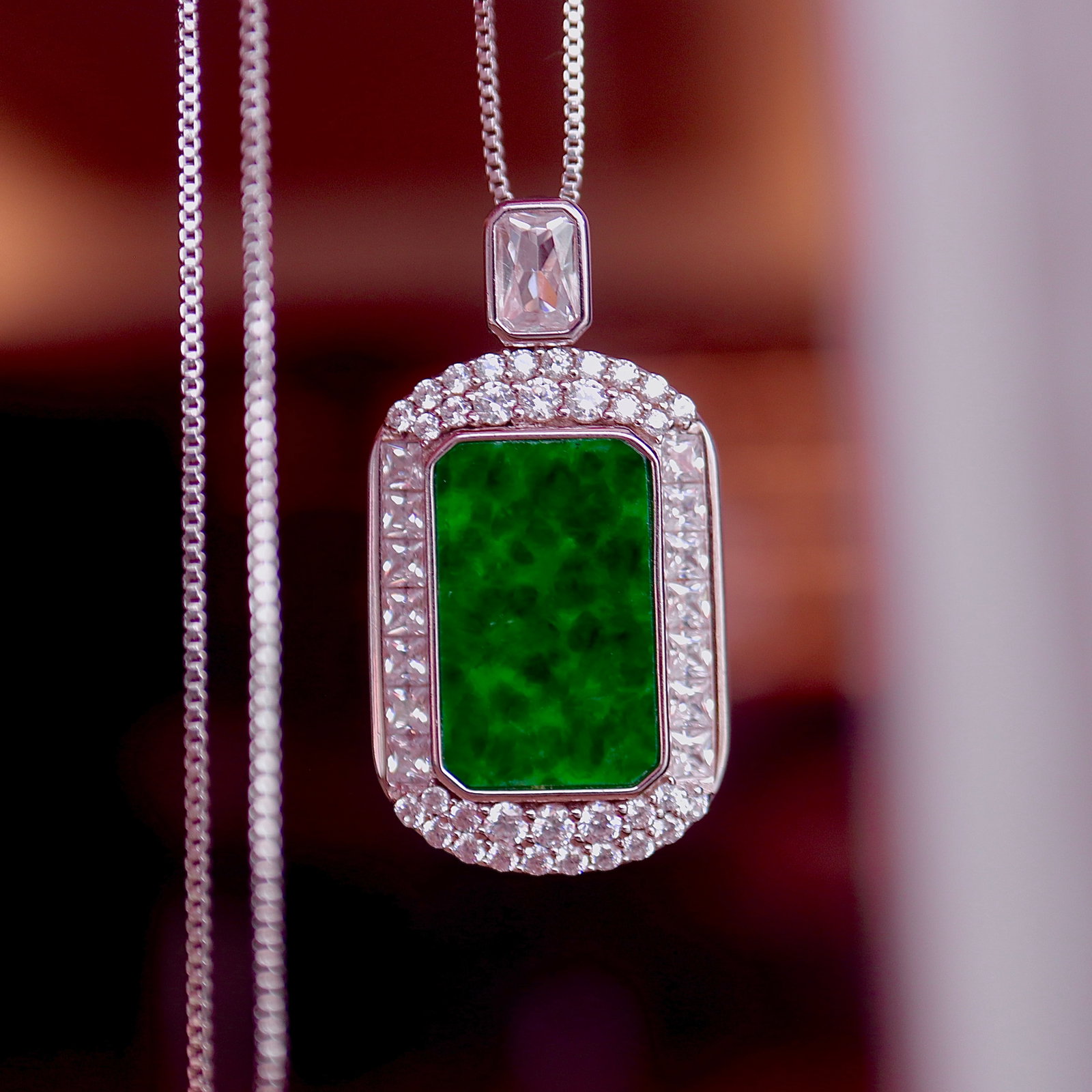 Natural Jadeite Pendant: Title: Natural Jadeite Pendant Description: This natural jadeite pendant is set in S925 sterling silver, showcasing the full color and green beauty of jadeite. The back is inlaid with