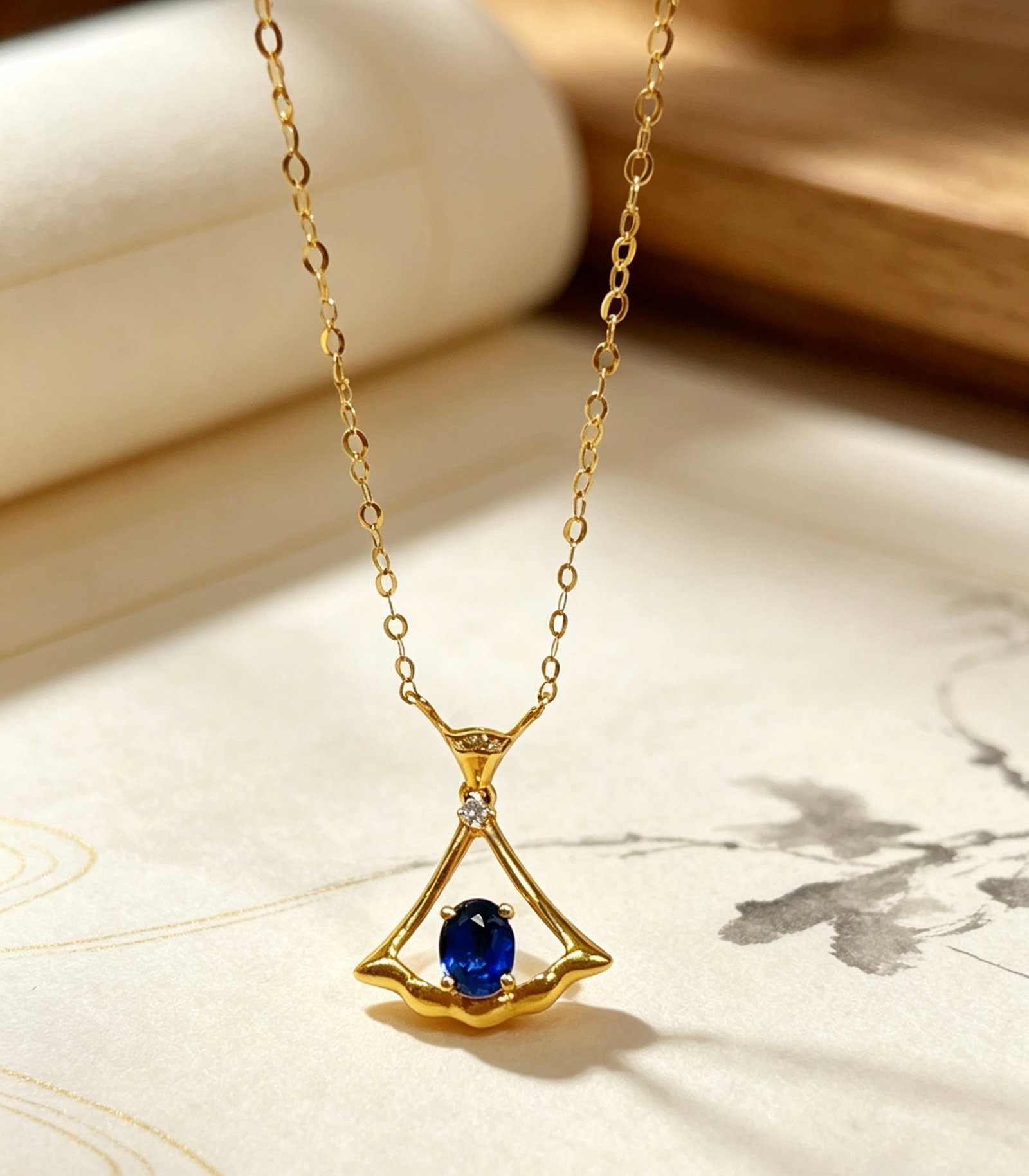Sapphire Collarbone Necklace: Title: Sapphire Collarbone Necklace Description: This collarbone necklace features a sapphire as the main stone, exuding a serene oriental beauty. The exquisite design complements the deep hue of the
