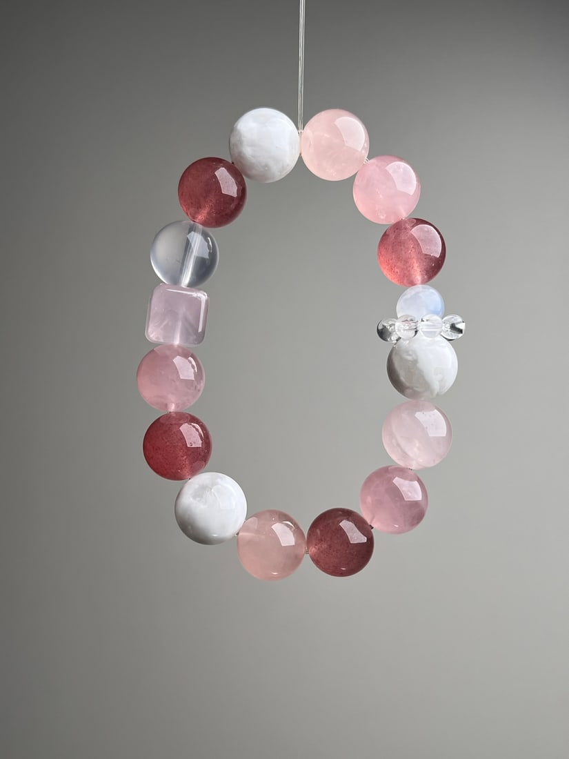 Natural Multi-Gem Bracelet: Title: Natural Multi-Gem Bracelet Description: This multi-gem bracelet is composed of natural pink sugar, strawberry quartz, white snowflake phantom, starlight pink, and white crystal. Each bead is