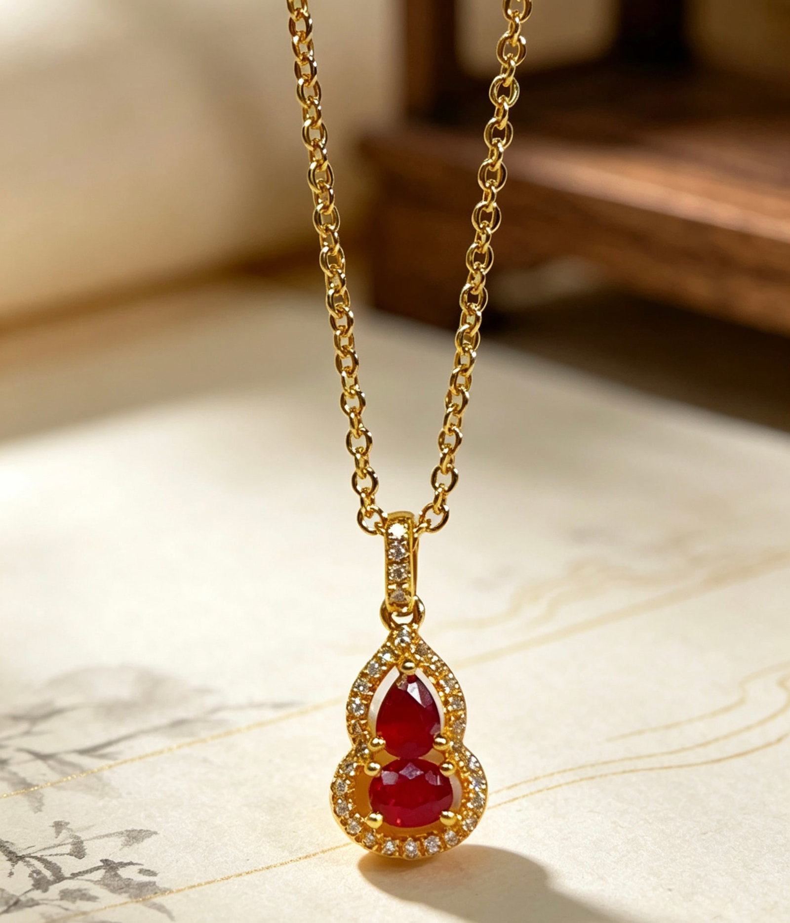 18K Gold Gourd Pendant: Title: 18K Gold Gourd Pendant Description: This 18K gold gourd pendant symbolizes good fortune and prosperity, with a delicate design suitable for everyday wear. The gourd shape represents luck and bl