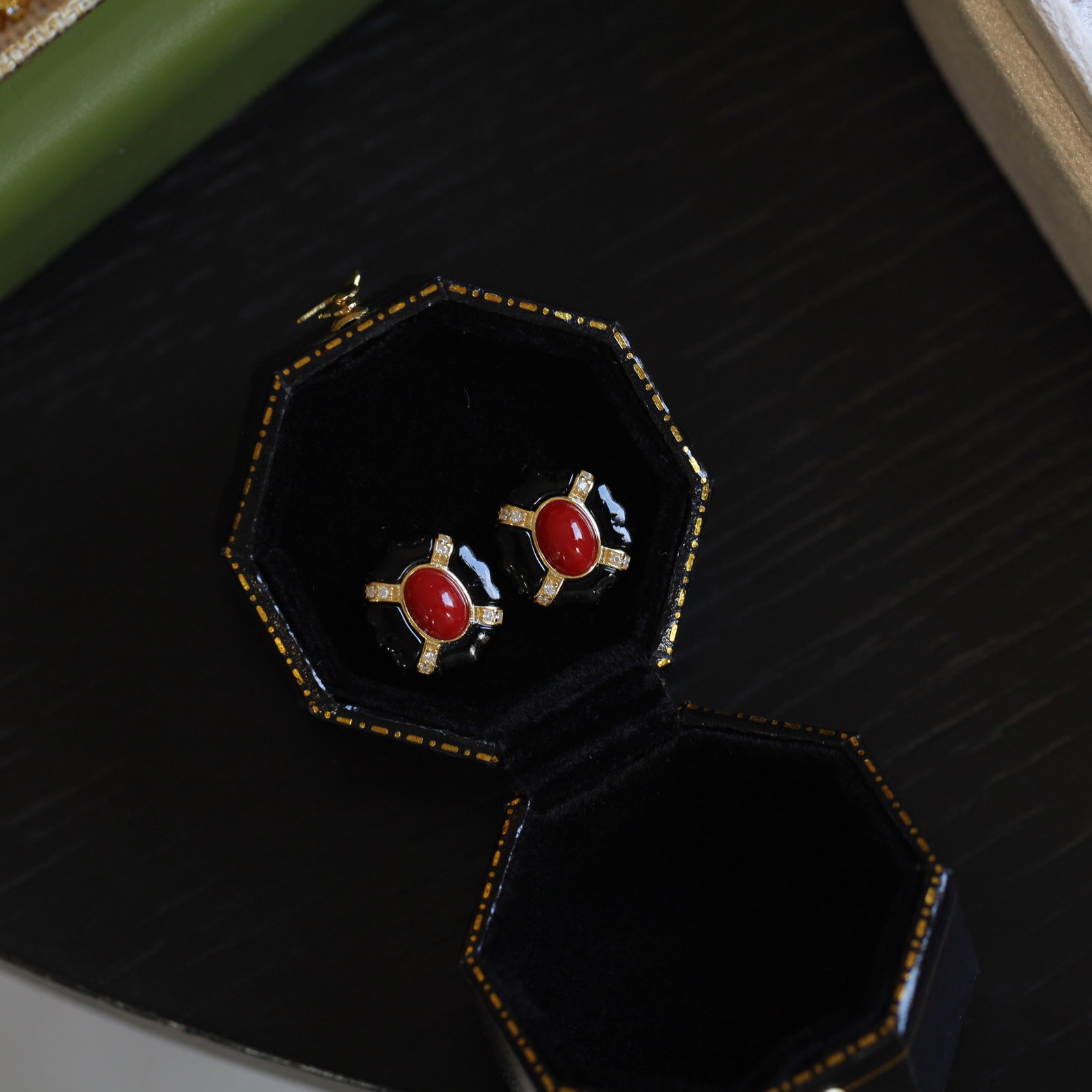 S925 Silver Natural Red Coral Earrings: Title: S925 Silver Natural Red Coral Earrings Description: Natural red coral main stone set in black onyx petal frame, surrounded by fine diamonds, showcasing exquisite vintage style. The combination