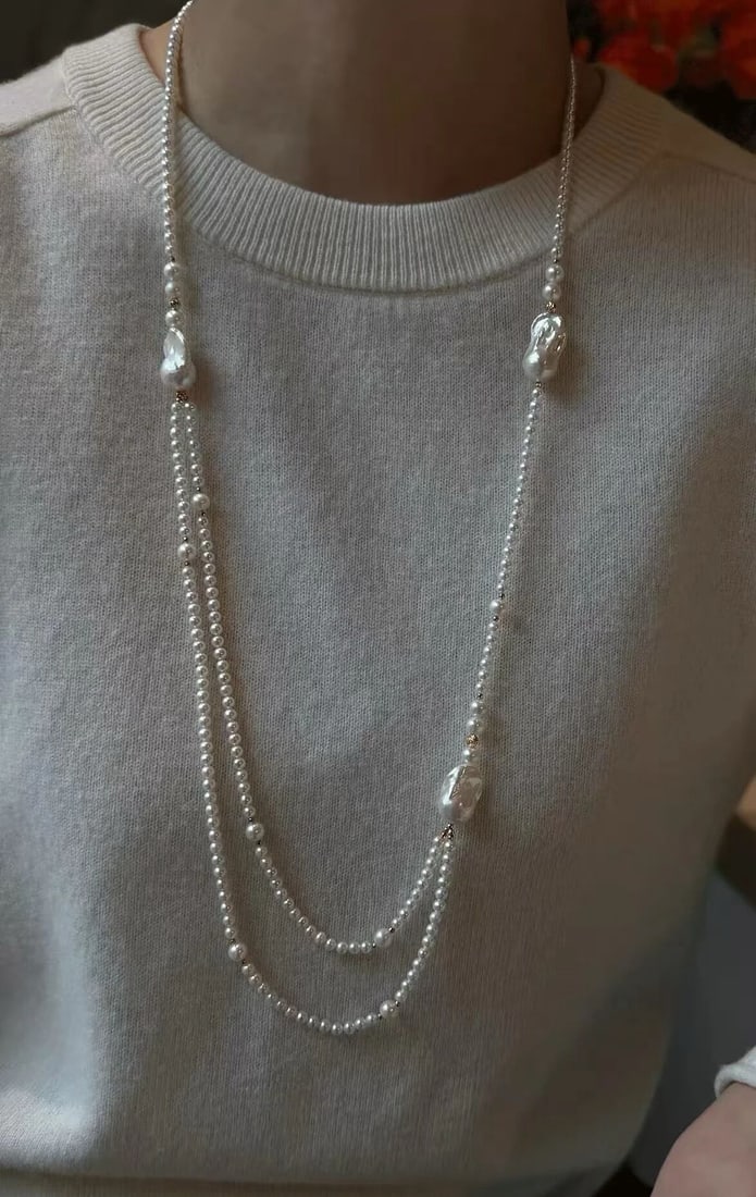 Near-round pearl necklace with minor flaws: Title: Near-round pearl necklace with minor flaws Description: This pearl captivates with its gentle hue. The perfect blend of pink, silver, and green presents a refreshing and exquisite color.
