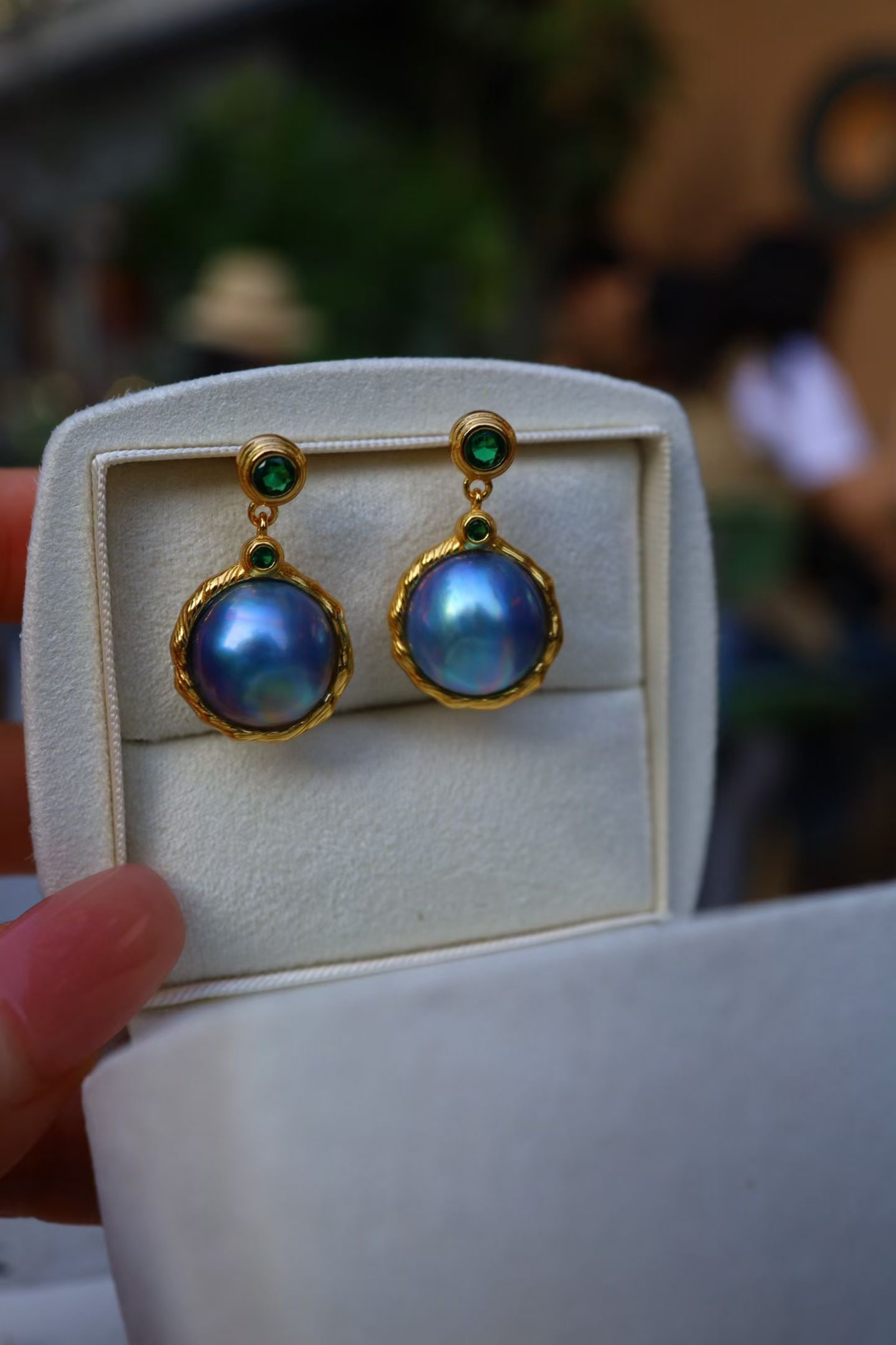 Natural Mabe Pearl Earrings: Title: Natural Mabe Pearl Earrings Description: These earrings feature natural Mabe pearls, showcasing a unique oceanic charm. The design is simple yet elegant, suitable for various occasions.