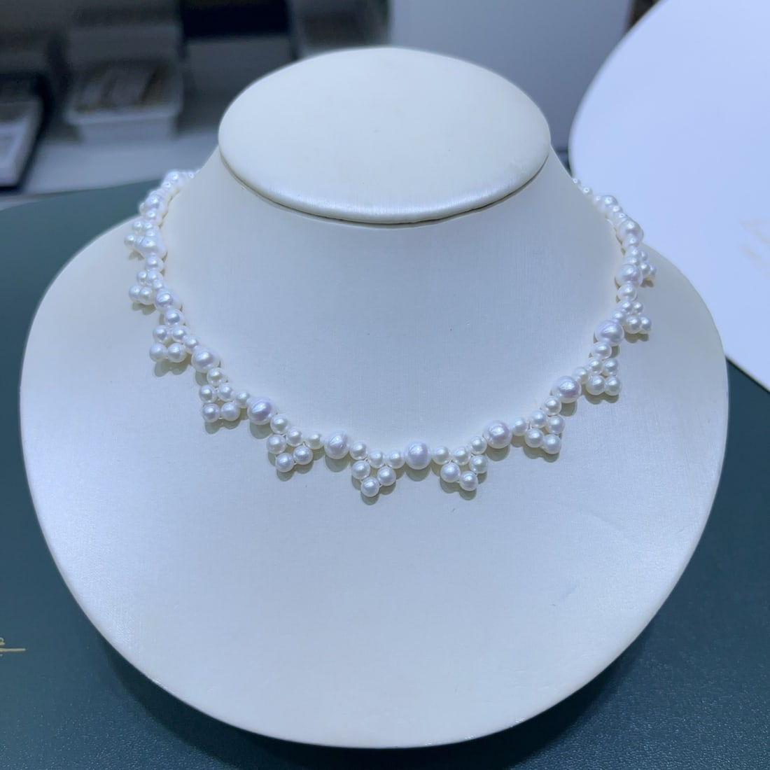 Natural White Pearl Necklace: Title: Natural White Pearl Necklace Description: This necklace is handcrafted with natural white pearls, ranging from 4-7mm in size, showcasing a near-round shape with slight blemishes. It exudes a