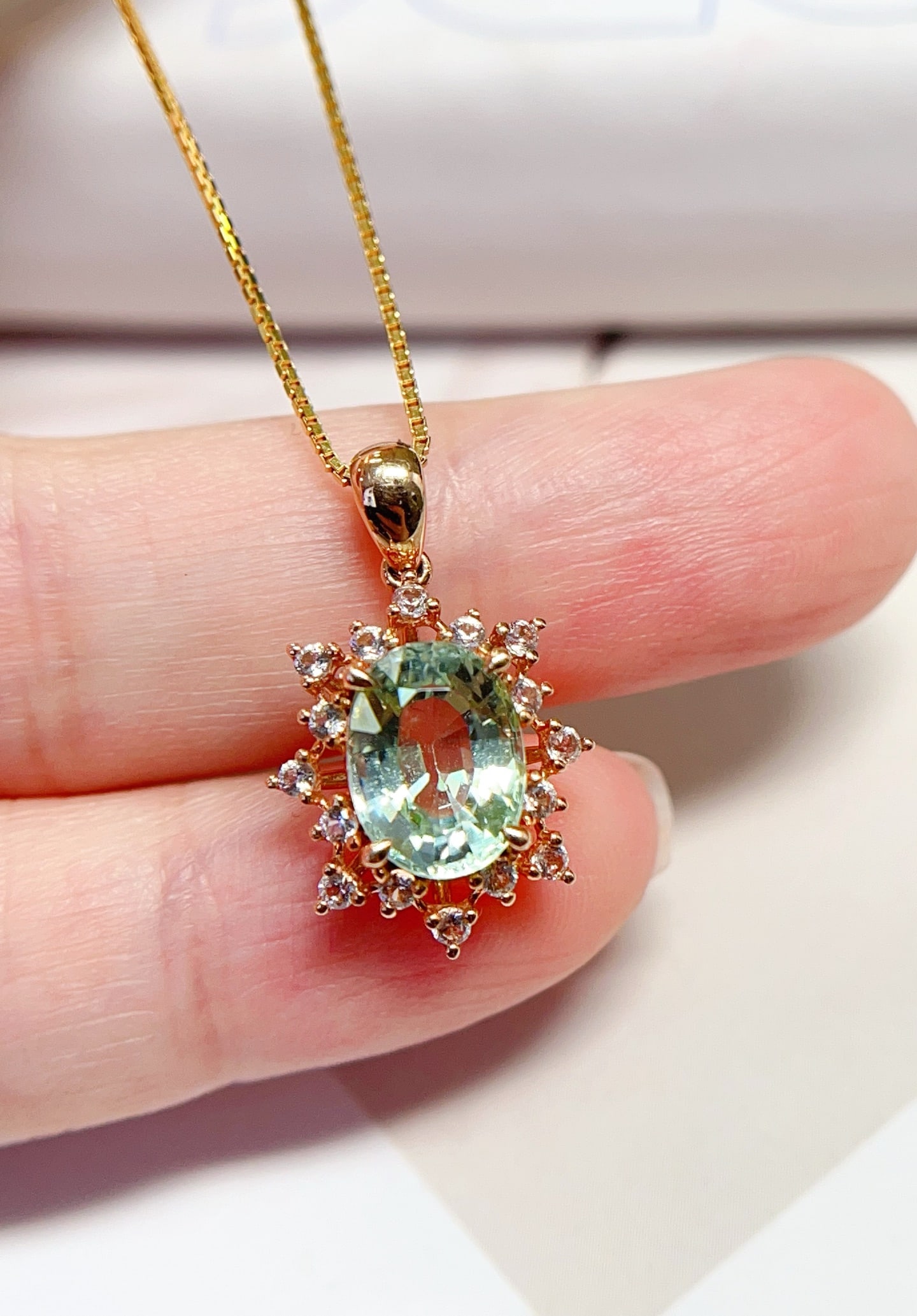 18K Gold Natural Tourmaline Pendant: Title: 18K Gold Natural Tourmaline Pendant Description: This pendant is meticulously crafted in 18K gold, featuring a mint green tourmaline with a flawless glassy texture. The brilliance of the