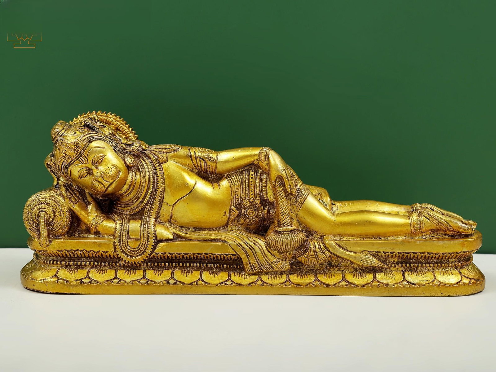 4" Small Reclining Hanuman Brass Idol | Religious Figurine: Description: See It In Your Home This brass statue of the monkey-god Hanuman is an excellent work of metal-craftsmanship. It represents Hanuman as resting lying on his right side with a large size