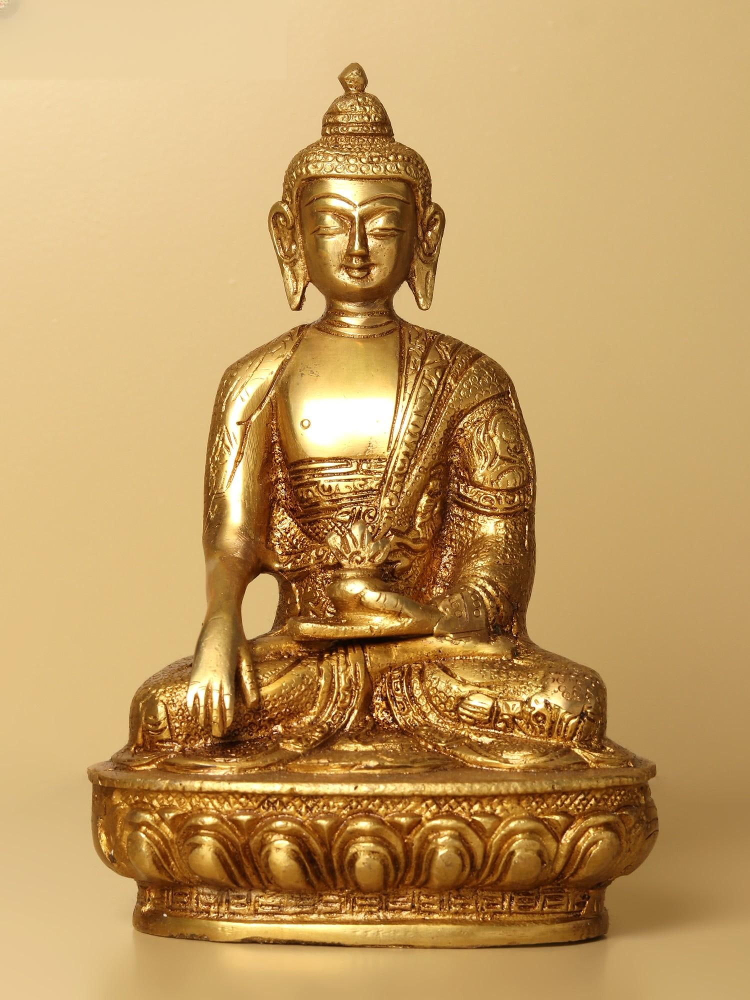 7" Brass Bhumisparsha Buddha Statue (Robes Decorated with Auspicious Symbols) | Handmade | Made in: Description: This picture depicts the Bhumisparsha Mudra , which means "touching the earth." At this time, Buddha summoned the earth goddess Sthavara to bear witness to his enlightenment. The sculptur