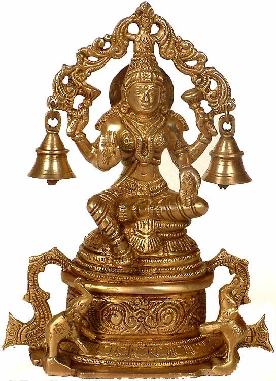 8" Goddess Lakshmi Statue with Elephants & Bells in Brass | Handmade | Made in India: Description: "In the presence of Lakshmi, abundance awakens in the gentle ring of bells." This brass sculpture portrays Goddess Lakshmi , the bestower of wealth and prosperity. Her presence is