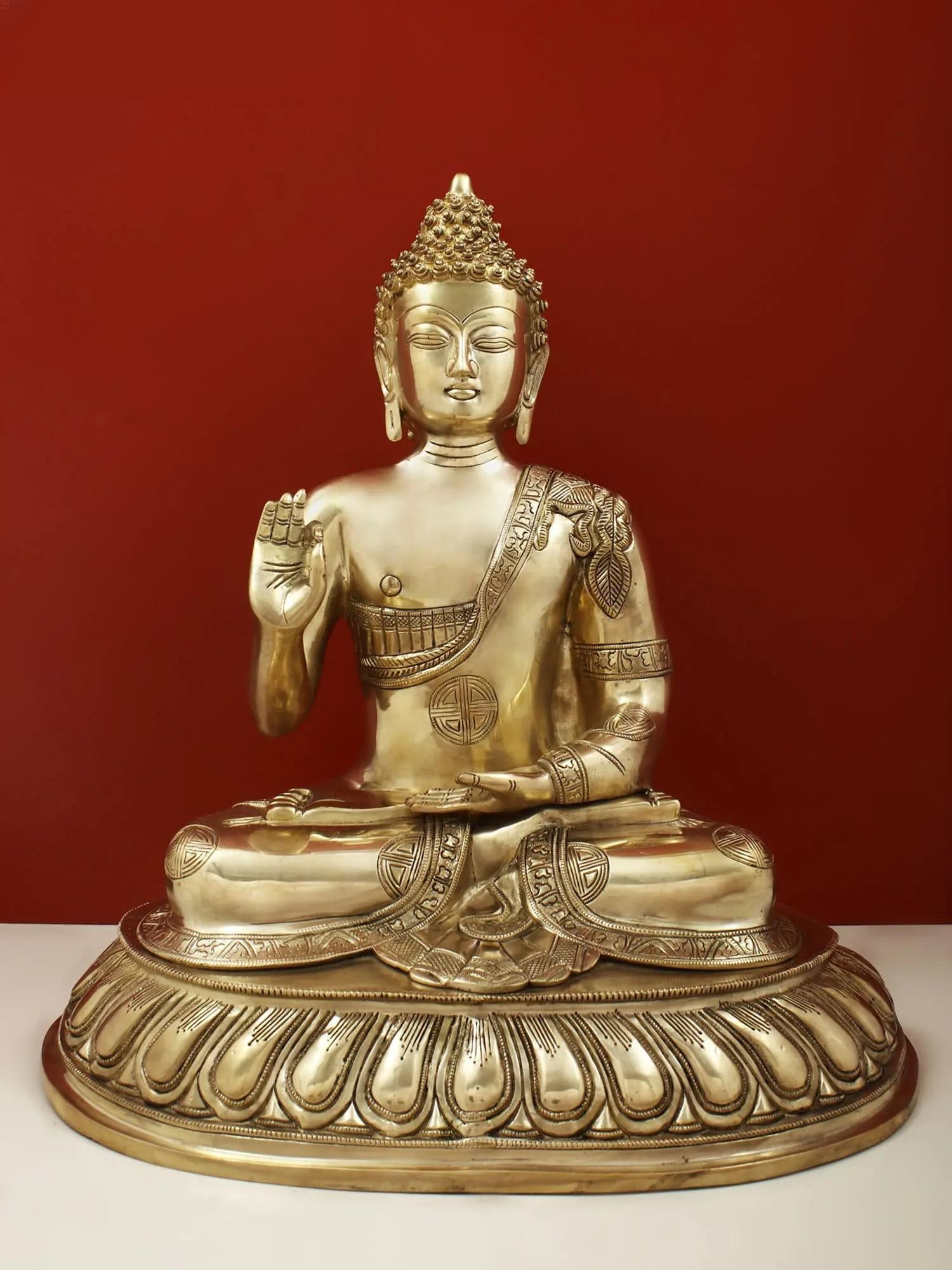 21" Blessing Buddha Seated on Lotus Throne with Sacred Symbols on His Robe In Brass | Handmade |: Description: 21" Blessing Buddha Seated on Lotus Throne with Sacred Symbols on His Robe In Brass | Handmade | Made In India itemcode: ET62 Reserve: $932 Shipping: Domestic: Shipping rates are