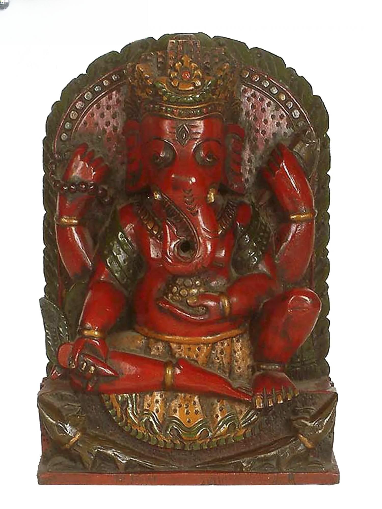 Idol of Bala Ganapathi Wooden Statue: Description: The statue depicts the child-like form of Ganesha who is also called the god of obstacles (Vighneshwara) and represents earth. The idol of Bala Ganapathi is elephant faced and has four ha