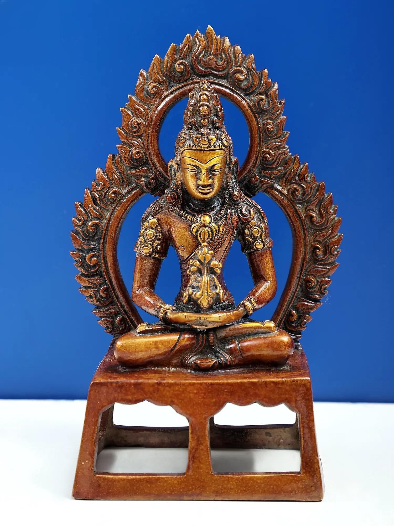 7" Crowned Buddha Brass Sculpture | Handmade: Description: This Crowned Buddha sculpture serves as a reminder to embrace the longevity that comes from nurturing the spirit and embracing the path of enlightenment. Its presence invites you to