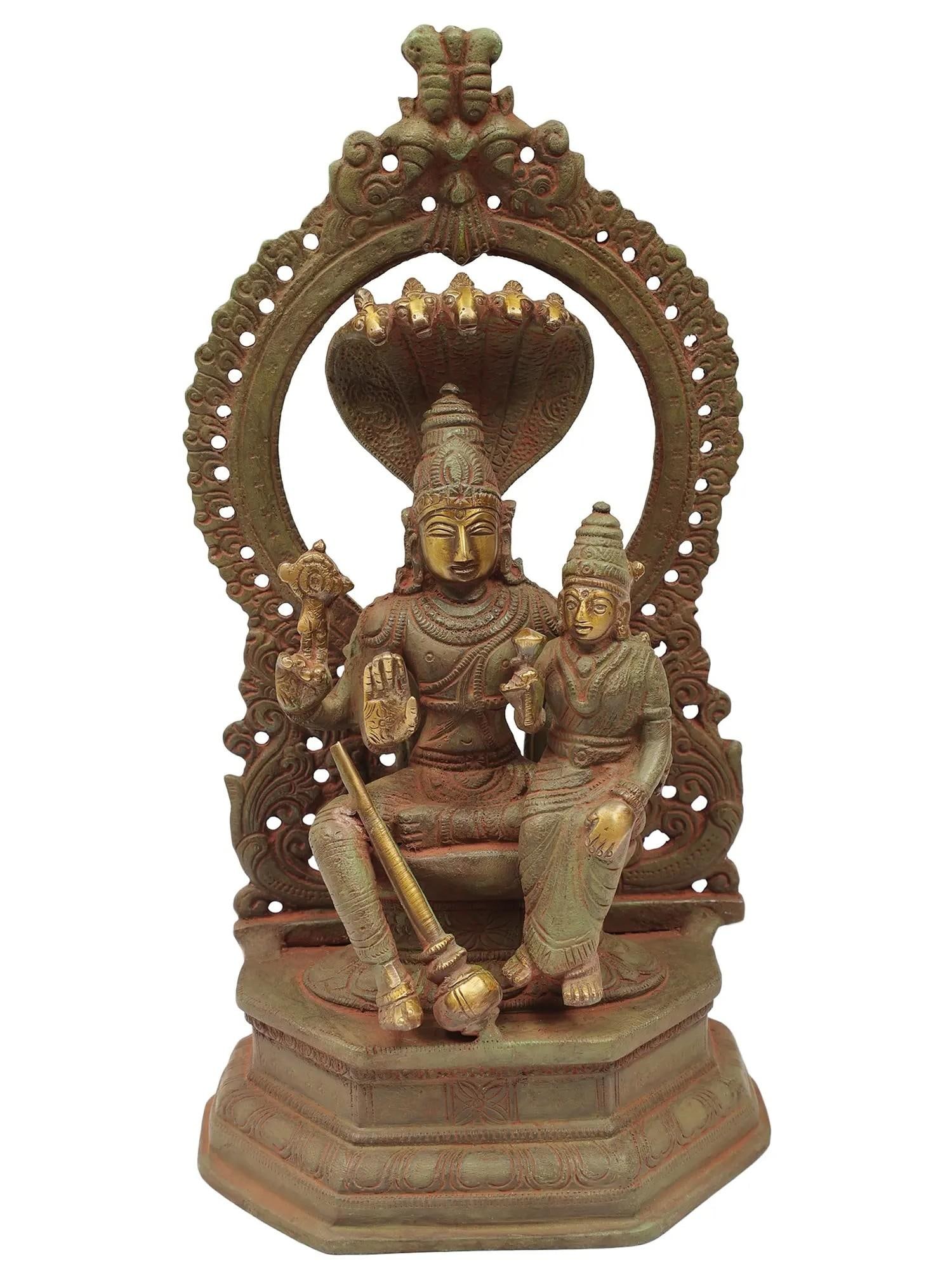 10" Lord Vishnu with Goddess Lakshmi | Handmade Brass Statue | Made in India: Description: See It In Your Home This exquisite depiction of Lord Vishnu and Goddess Lakshmi beautifully captures them holding their distinctive attributes - Vishnu with his Sudarshan Chakra and