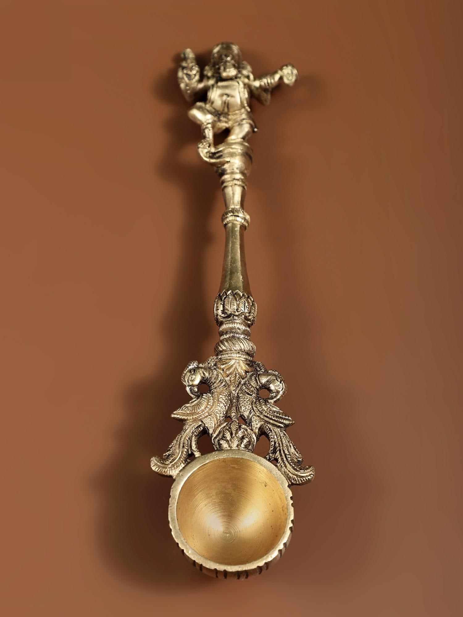 Dancing Ganesha Ritual Spoon: Description: See It In Your Home The Pali or Panchamrita spoon is another name for this bronze ceremonial spoon. It is commonly encountered in conjunction with the Panchapatra (container for Panchamri
