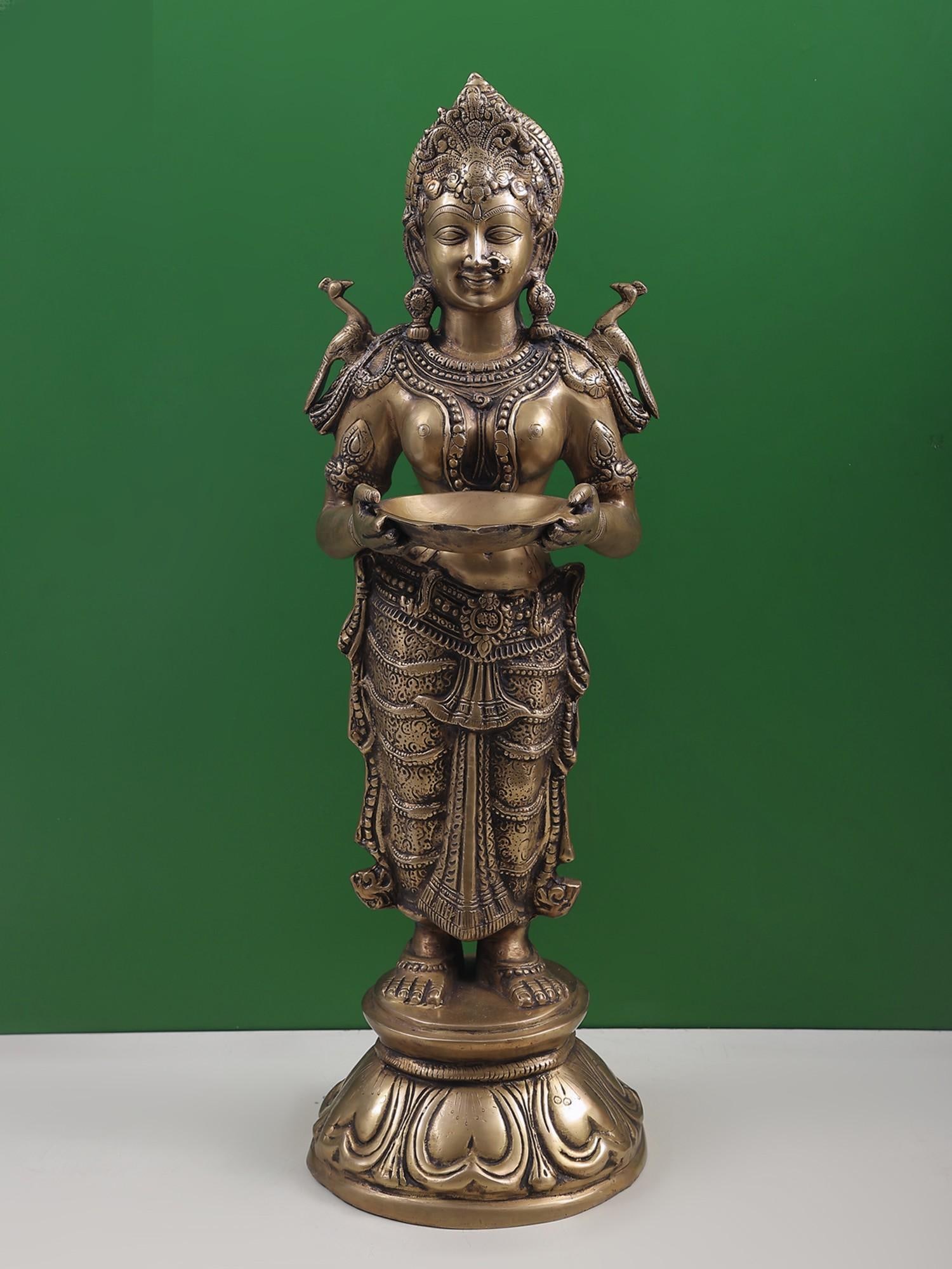 30" Deeplakshmi In Brass | Handcrafted In India: Description: “Deepa” or lamp in Hindu religious tradition is an integral part of the everyday ritual. From the Garbha-griha of a temple to the personalized place of worship in the house of a d