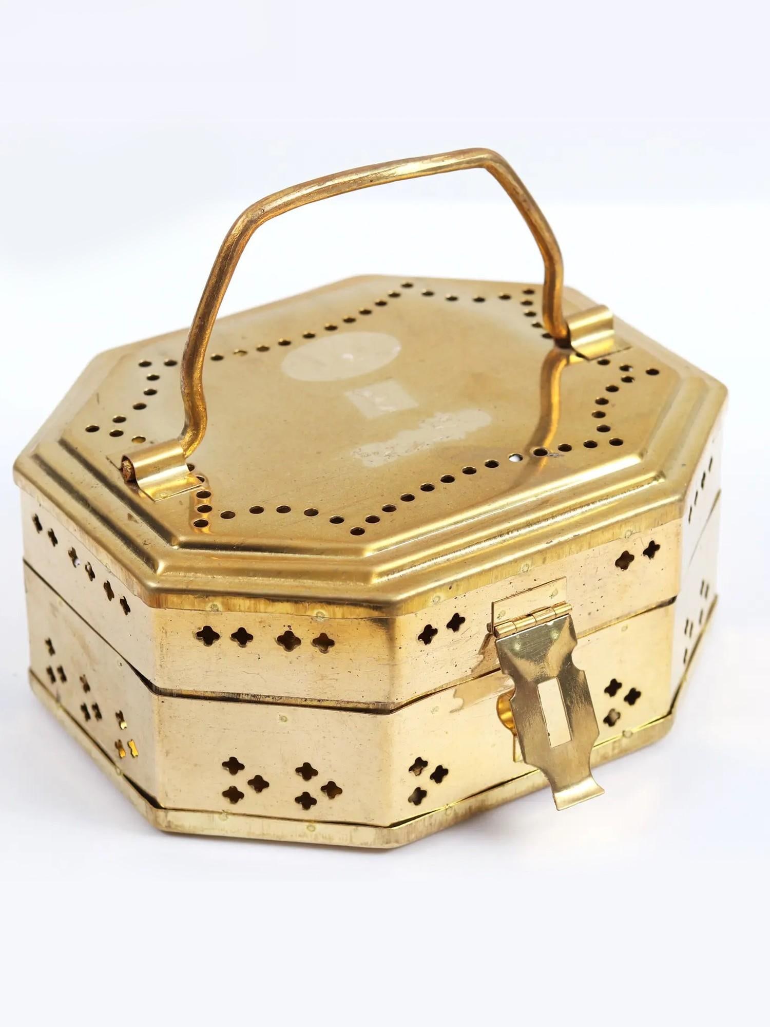 Brass Bal Gopala Ritual Travel Box: Description: This meticulously crafted box features the spirit of Bal Gopala, the playful child form of Lord Krishna. The details on the brass and the secure closure make it perfect for storing your