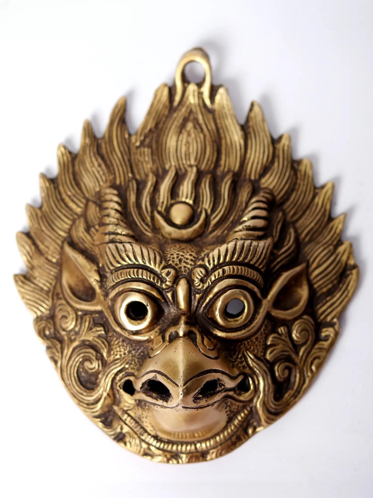 5" Brass Garuda Wall Hanging Mask: Description: Soar with the divine on this captivating Brass Garuda Wall Hanging Mask. Channel the power and loyalty of Garuda, the mighty bird-God and mount of Lord Vishnu - from his sharp talons to