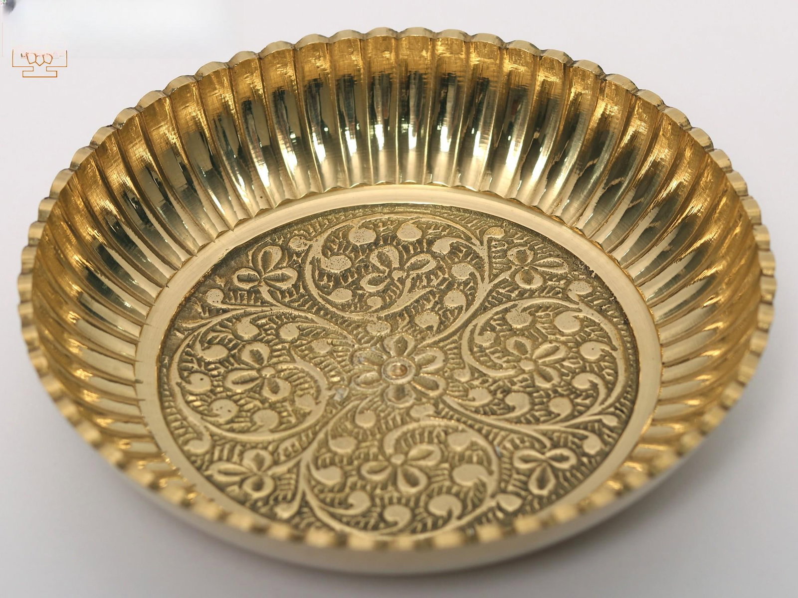 Brass Floral Design Small Plate (Multiple Sizes): Description: "Life's beauty lies in its delicate details." These Brass Floral Design Plates, available in various sizes, celebrate the intricacies of nature. Each plate is a canvas where