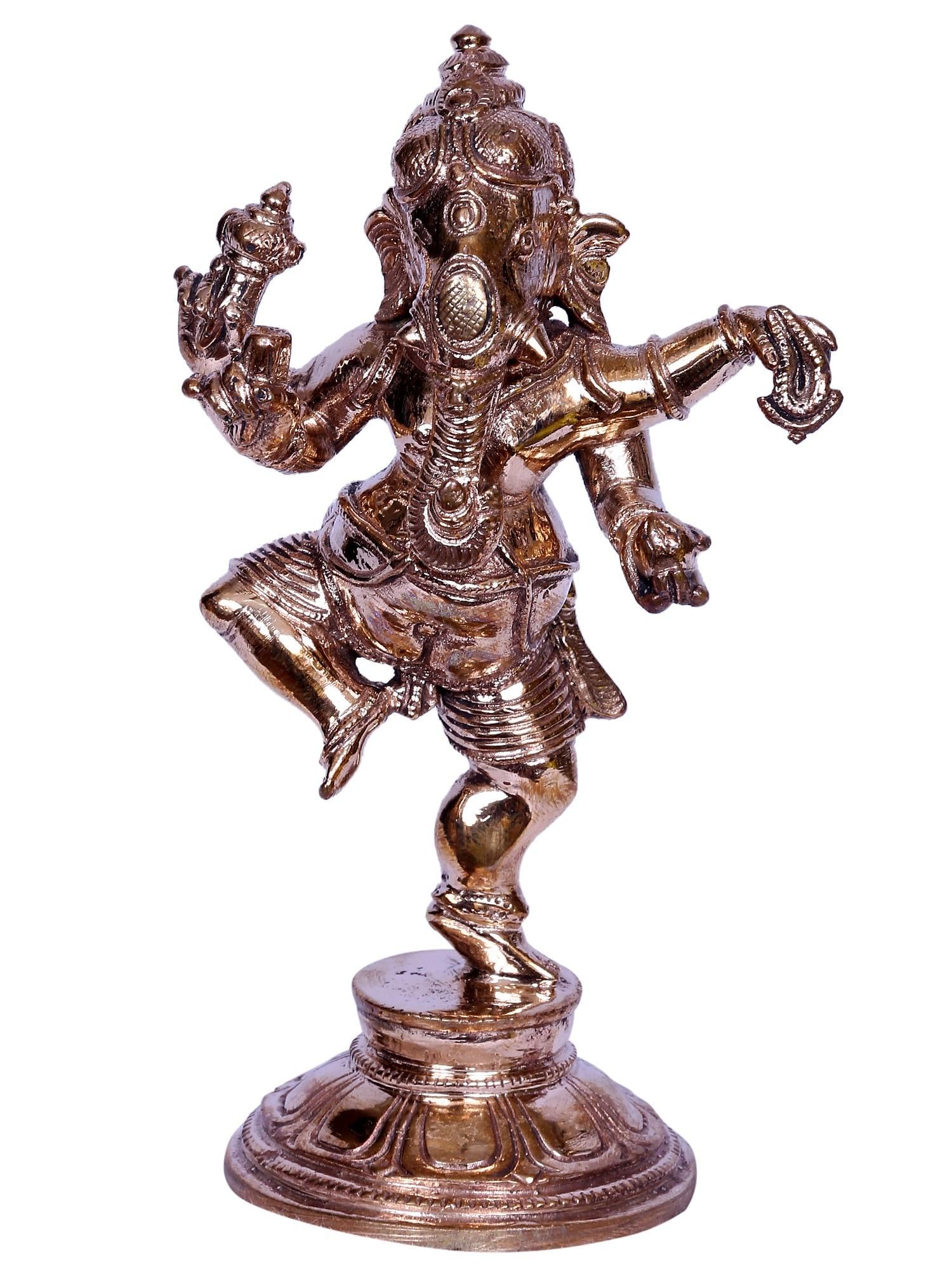 5" Small Lord Dancing Ganesha Idol | Madhuchista Vidhana (Lost-Wax) | Panchaloha Bronze from: Description: In the rhythmic cadence of cosmic vibrations, Nritya Ganpati , “the Lord of Dance”, emerges, a divine spectacle of celestial dance. With grace transcendent, Ganesha twirls, a