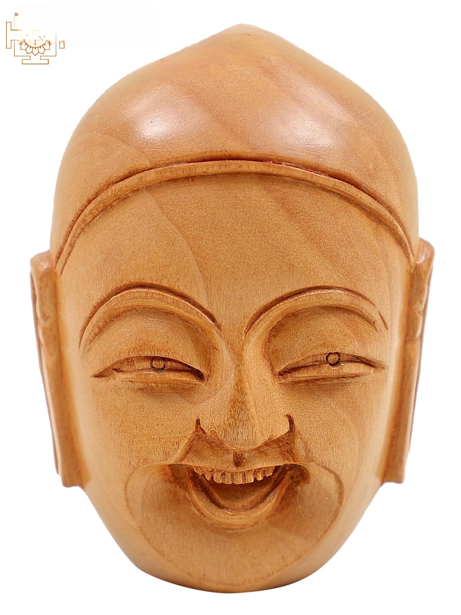 3" Small Wooden Laughing Buddha Head Statue: Description: With a calm mind, discover the laughter within." This stunning wooden sculpture captures the essence of the Laughing Buddha's wisdom through his serene countenance. The polished wood repr