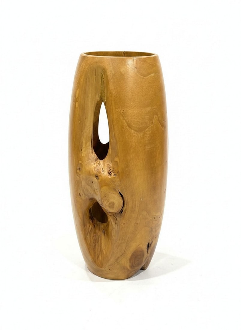 Live Edge Teak Wood Vase or Planter: This is a unique live edge teak wood vase or planter, featuring natural holes and significant graining. The wood has a warm, medium brown tone and a smooth finish. It appears to be carved from a