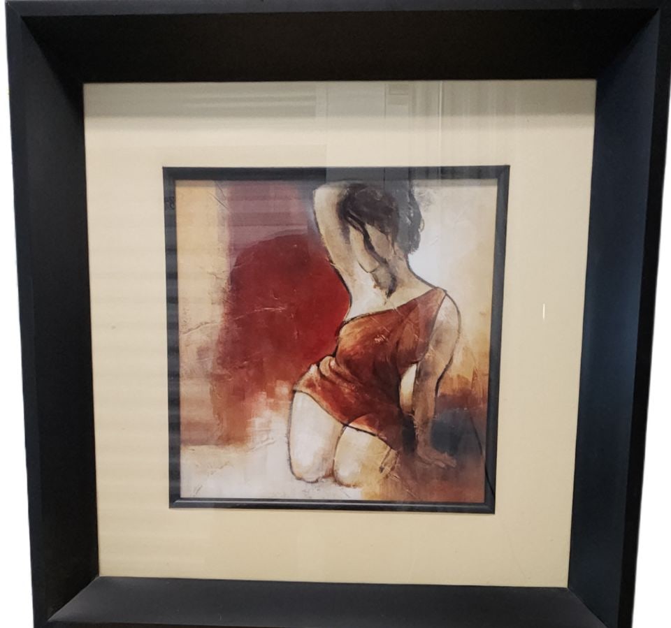 Seated Woman II, 15 x15" quality abstract impressionist print by award-winning artist Lanie Loreth: Framed contemporary art print on paper. This piece features a figurative abstract of a seated woman in a red dress. The artwork is matted in a cream-colored mat and housed in a thick, black wooden fra