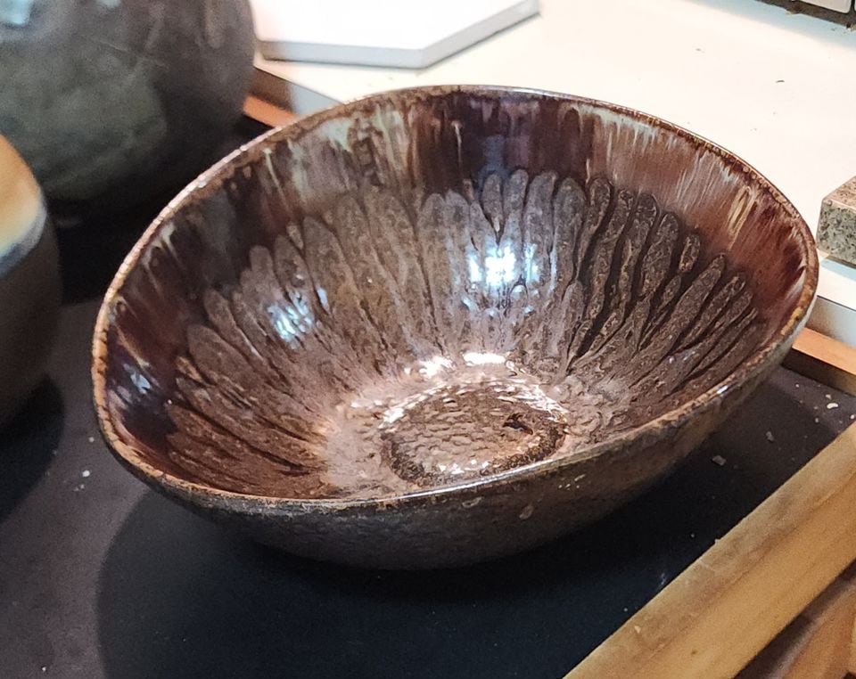 Vintage Sculptural Handcrafted 11"/11.5"D x 5"H Mid-Century Brown Glazed Ceramic Art Bowl: Stunning mid-century ceramic art bowl with sculptural design and a rich brown glaze. This piece is multi-tonal with a textured interior with a petal-like pattern radiating from the center. The