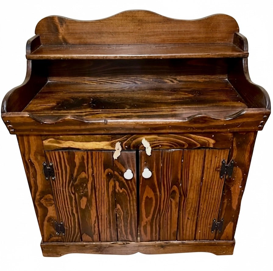 Rustic Pine Washstand / Dry Sink with Scalloped Backsplash: A rustic pine washstand or dry sink with a dark stain, featuring a scalloped backsplash and upper shelf. The cabinet has two doors with white ceramic knobs and exposed black metal hinges. The wood