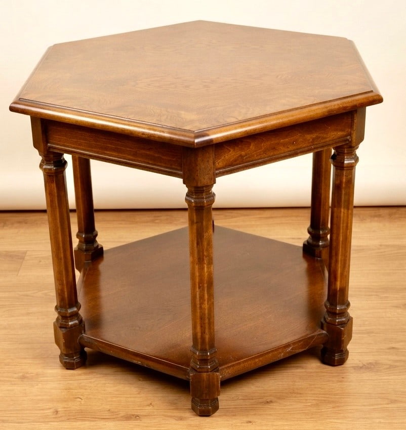 Vintage Hexagonal Two-Tier Walnut Side Table: A charming vintage hexagonal side table crafted from rich walnut, featuring a two-tier design with turned legs and a lower shelf. The top surface displays an attractive wood grain pattern with a