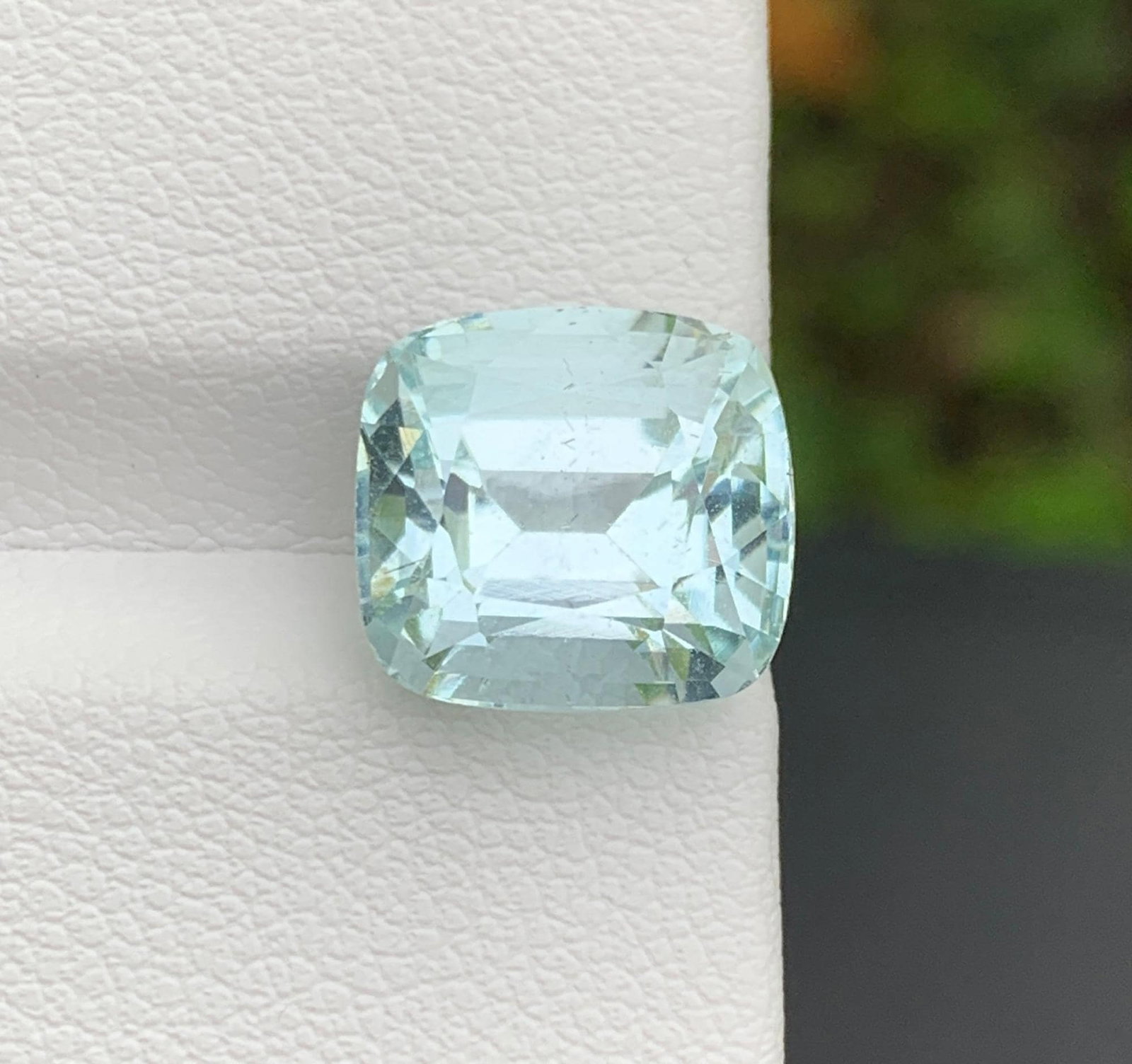 Natural Pakistan Aquamarine Gemstone 5.81 Carat Cushion Cut - Loose Sky Blue Aquamarine for Ring: Discover the breathtaking beauty of this Natural Pakistan Aquamarine weighing an impressive 5.81 carats. Expertly fashioned in an elegant Emerald Cut, this gemstone showcases a captivating sky-blue co