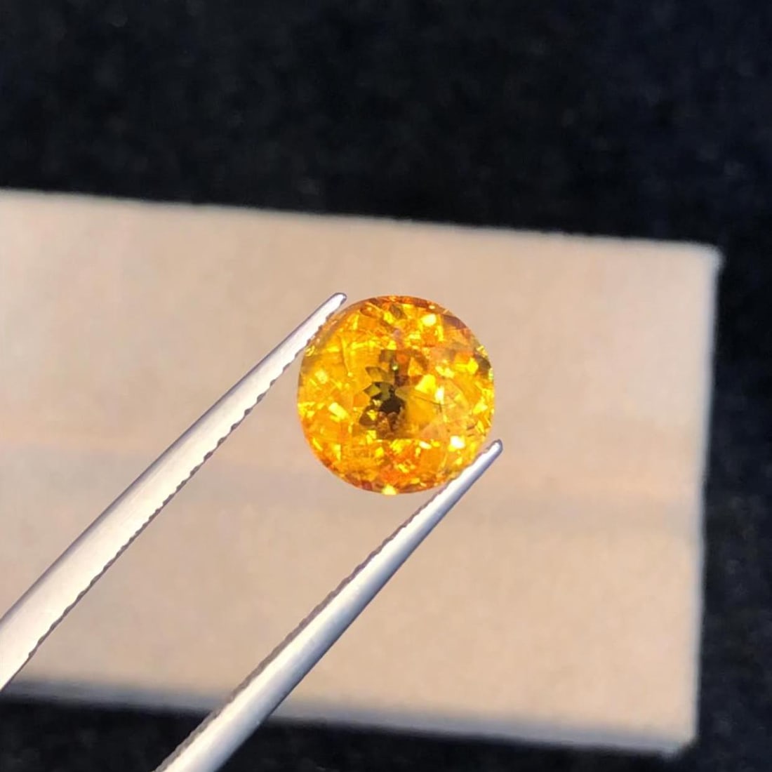 Round Sphene Gemstone: Faceted Titanite, Intense Sparkle (2.715 CT): This stunning full fire sphene titanite loose gemstone features a captivating round cut that enhances its brilliance and beauty. With its vibrant play of colors and exceptional clarity, this gemstone