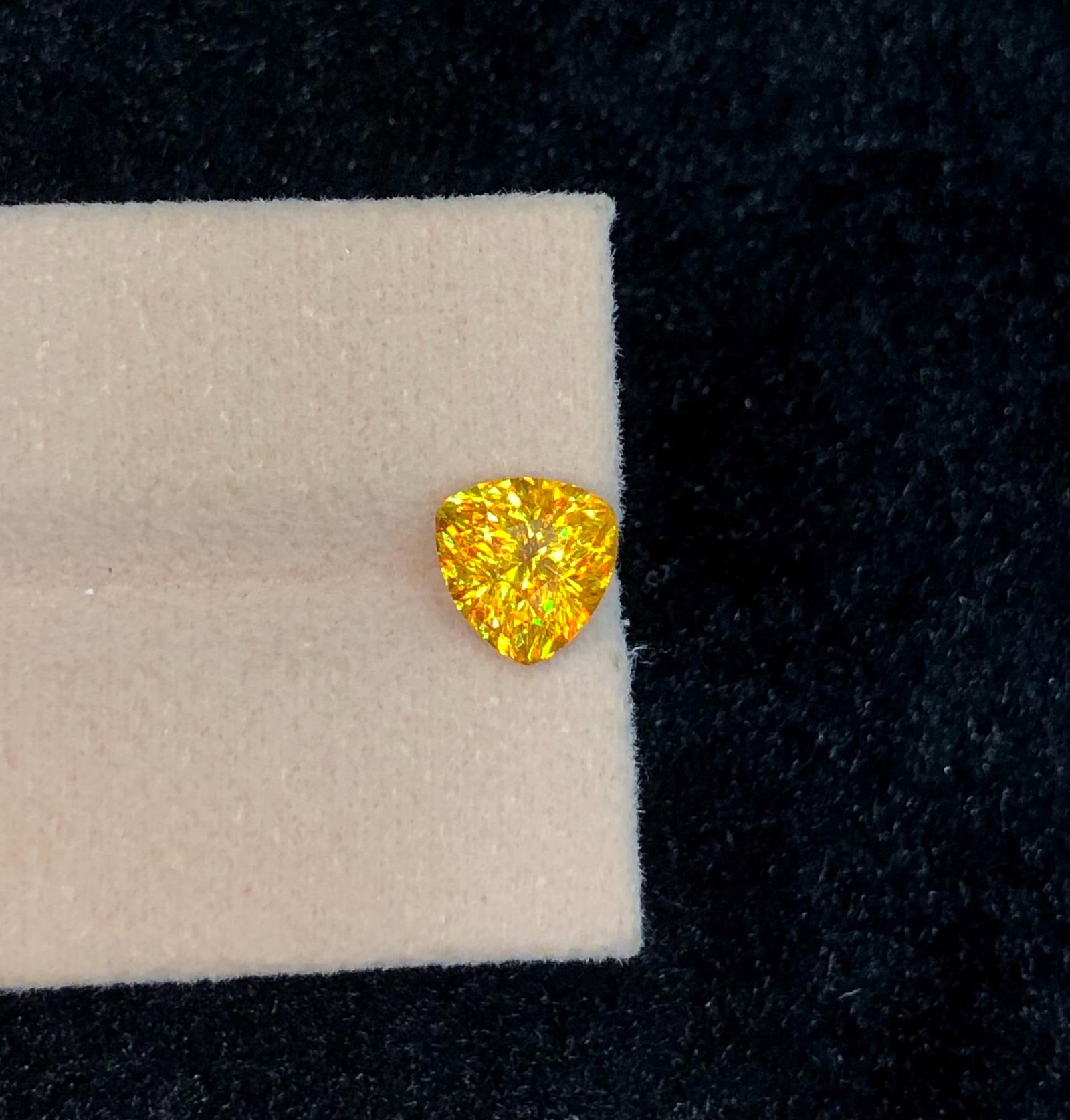 Trillion Cut Sphene Titanite Gemstone: Yellow Orange Sparkle, 2.245 Ct: Highlights Supplies for making crafts Materials: Gemstone: Sphene Carat weight: 2.245 This stunning full fire sphene titanite loose gemstone features a captivating Trillion cut that enhances its