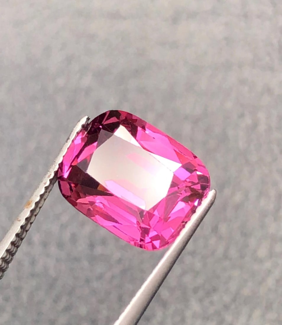 Natural Garnet Purplish Pink Gemstone From Kala Lani Tanga Mine Tanzania - 3.120 Carat: Gemology: * Weight : 3.120 carat * Dimension : 9.6*7.4*4.7 mm * Origin : Tanzania ( Kalalani Tanga Mine ) * Color: Purplish Pink Garnet * Clarity : VVS * Shape : Emerald Cut * Hardness : 6.5 - 7.5 *