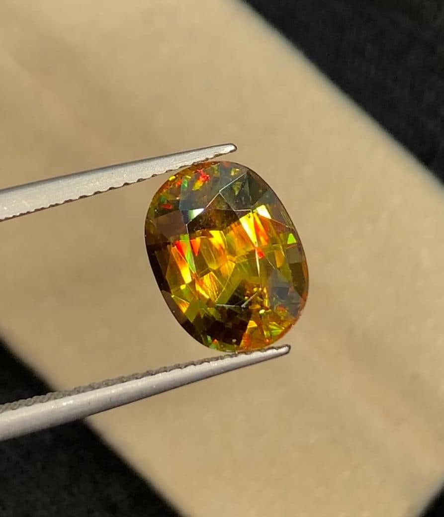 4.90 CT Cushion Cut Sphene Gemstone: Yellow-Green Titanite: Create your one-of-a-kind piece and shine with Sphene's brilliance!" Sphene is one of those magical gems that can really enchant you-the best faceted examples display brilliant fire and flash three di