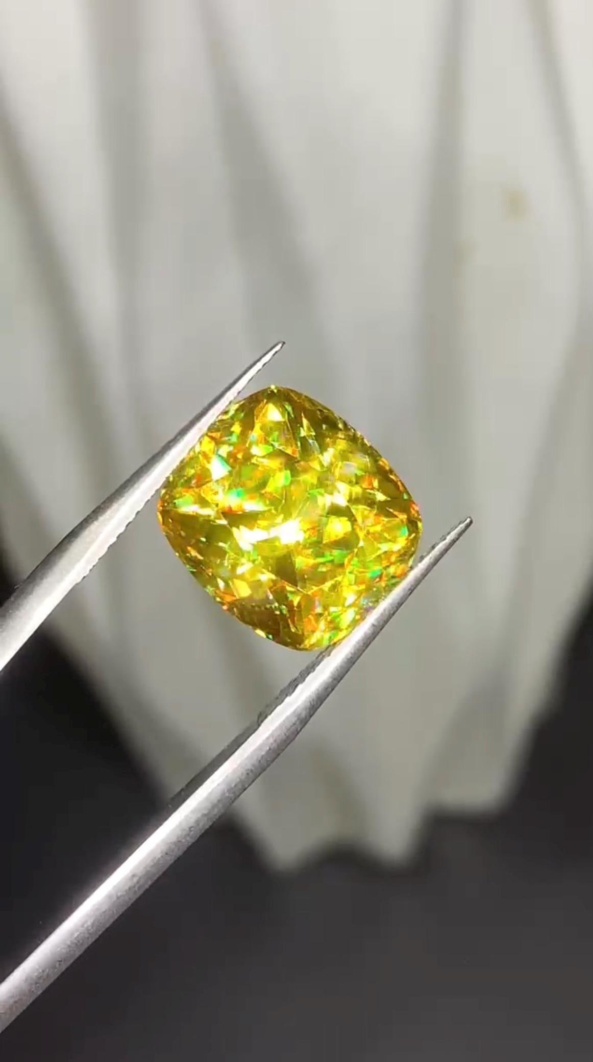 Intense Fire Magadascar Sphene Gemstone, Yellow Cushion Cut Stone 7.20 Carat: Gemstone Details: Gemstone: Sparkling Sphene Titanite Dimensions: 11.87*10.45*7.88 mm Weight: 7.20 Carat Cut: Cushion Color: Yellow Clarity: VVS Origin : Madagascar Treatment: None Mineral Class: