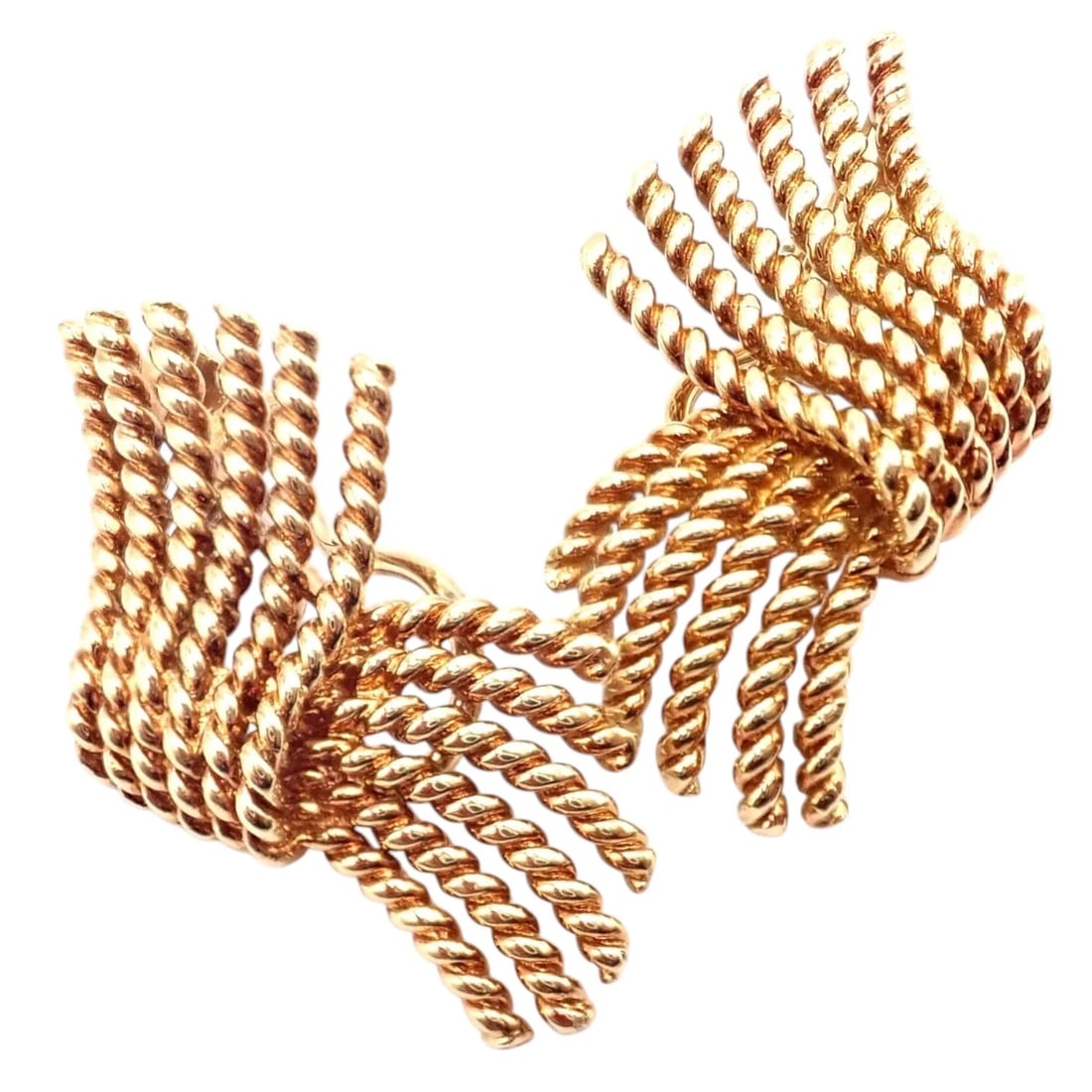 Gold rope: These authentic Tiffany & Co. Jean Schlumberger rope earrings are crafted in 18k yellow gold. The bold sculptural design features twisted rope-style gold strands arranged in an elegant dimensional for