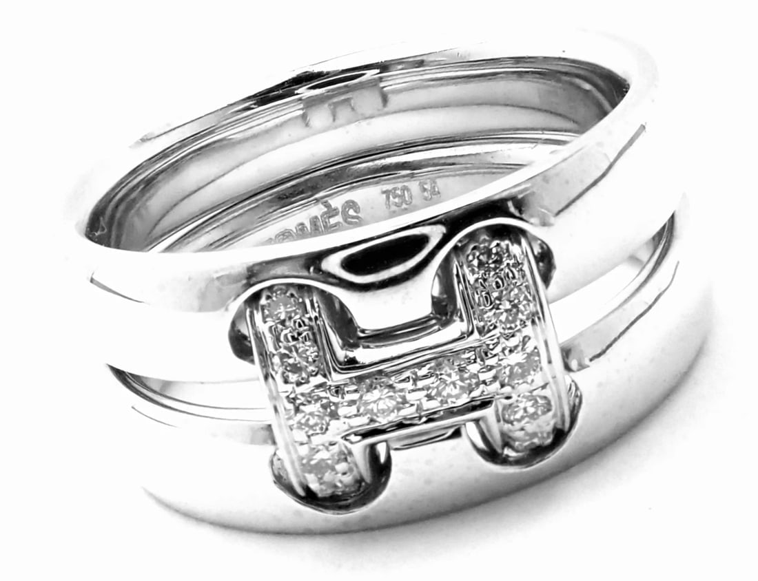 Authentic! Hermes 18k White Gold Diamond H Double Band Flex Band Ring: Authentic! Hermes 18k White Gold Diamond H Double Band Flex Band Ring About This Piece: Metal: 18k White Gold Size: European 54, US 6 3/4 Measurements: Weight: 11.2 grams Width: 9mm Stones: 12 round b
