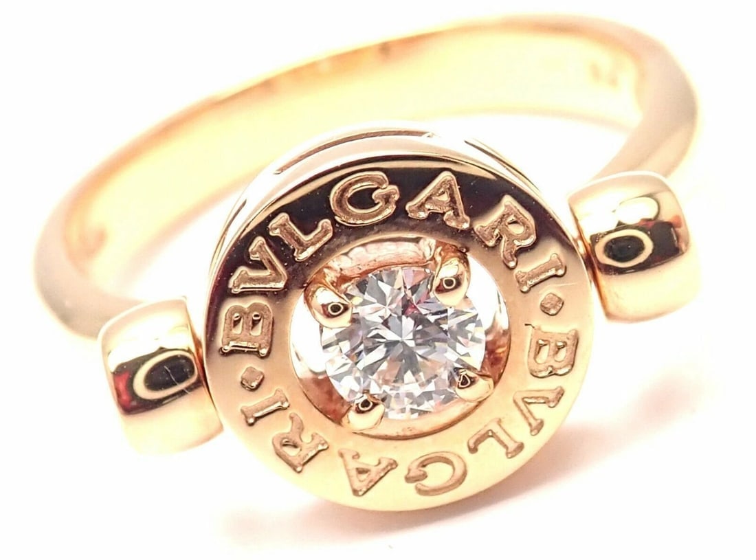 Authentic! BULGARI BVLGARI 18k Rose Gold Diamond Flip Ring Size 5.75: Authentic! BULGARI BVLGARI 18k Rose Gold Diamond Flip Ring Size 5.75 About This Piece: Metal: 18k Rose Gold Ring Size: European 51, US 5 3/4 Measurements: Weight: 6.1 grams Width: 9mm Stones: 1 round 