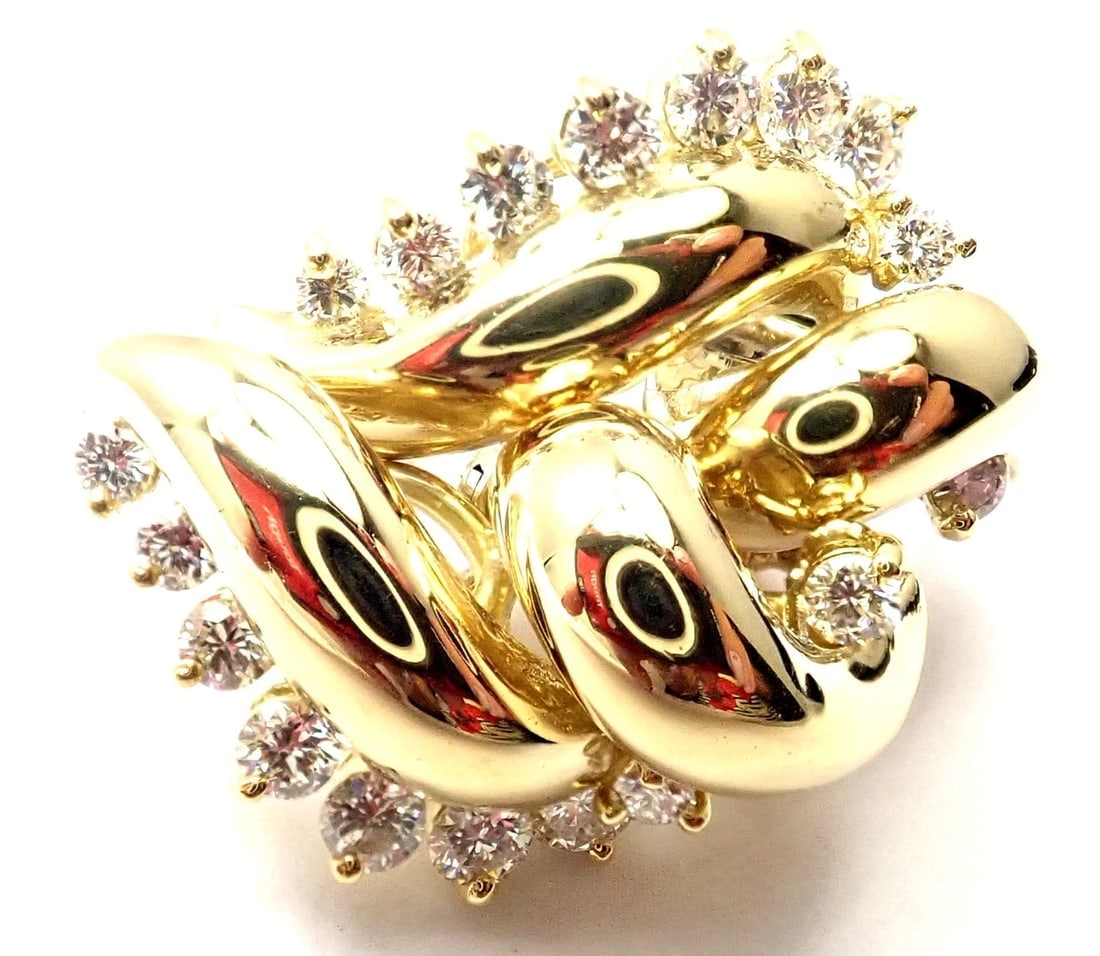 Rare! Authentic Tiffany & Co 18k Yellow Gold Diamond Swirl Earrings: Rare! Authentic Tiffany & Co 18k Yellow Gold Diamond Swirl Earrings About This Piece: These earrings are made for pierced ears. Metal: 18k Yellow Gold Dimensions: 23mm x 15mm Weight: 11.5 grams Stones