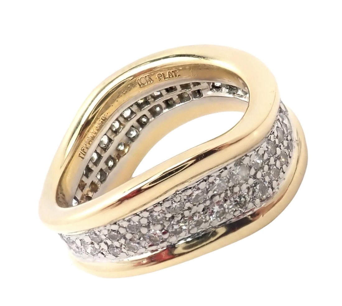 Authentic! Tiffany & Co 18k Yellow Gold Platinum Diamond Wave Band Ring: Authentic! Tiffany & Co 18k Yellow Gold Platinum Diamond Wave Band Ring About This Piece: Metal: 18k Yellow Gold And Platinum Ring Size: 5.75 Band Width: 6mm to 8mm Weight 9.7 grams Stones: 58 Round B