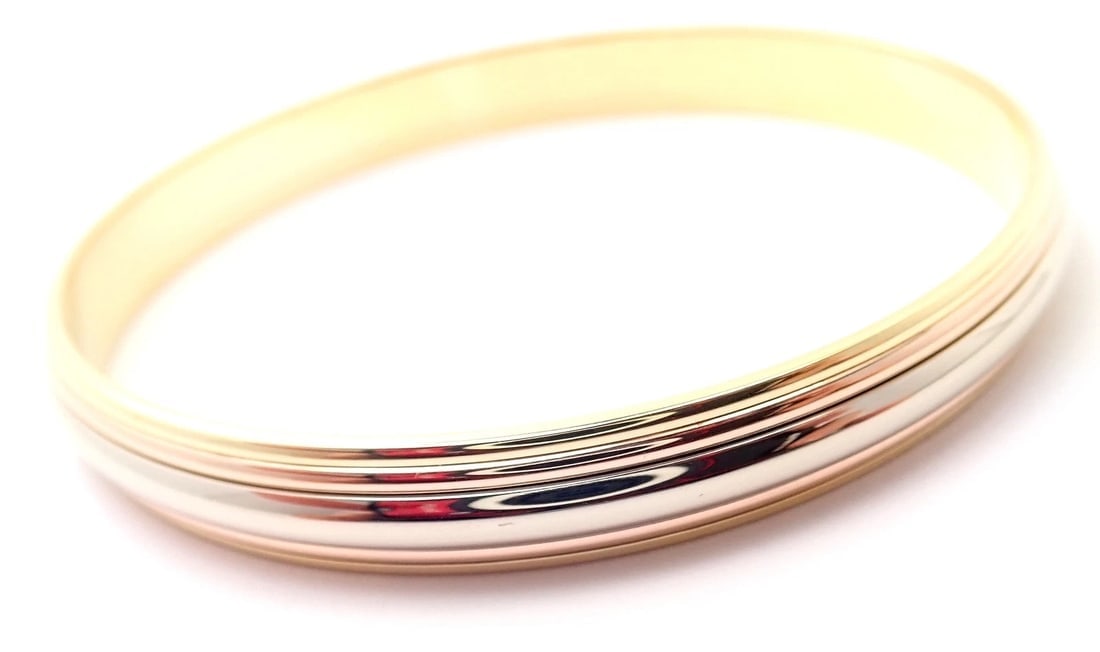 Rare! Cartier 18k Tricolor Gold Slip-On Bangle Bracelet 1990: Rare! Cartier 18k Tricolor Gold Slip-On Bangle Bracelet 1990 About This Piece: About Cartier: The company has a long and distinguished history of serving royalty, as well as stars and celebities. One 