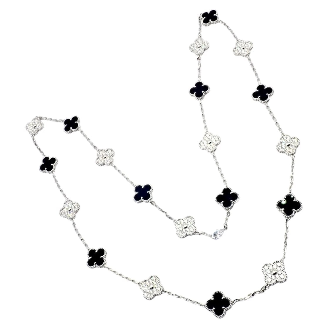 Van Cleef & Arpels 18k Gold 20 Motif Vintage Alhambra Diamond Onyx Necklace Cert: Van Cleef & Arpels 18k Gold 20 Motif Vintage Alhambra Diamond Onyx Necklace Cert About This Piece: The Van Cleef & Arpels 18k White Gold 20 Motif Alhambra Necklace features the iconic clover-inspired 