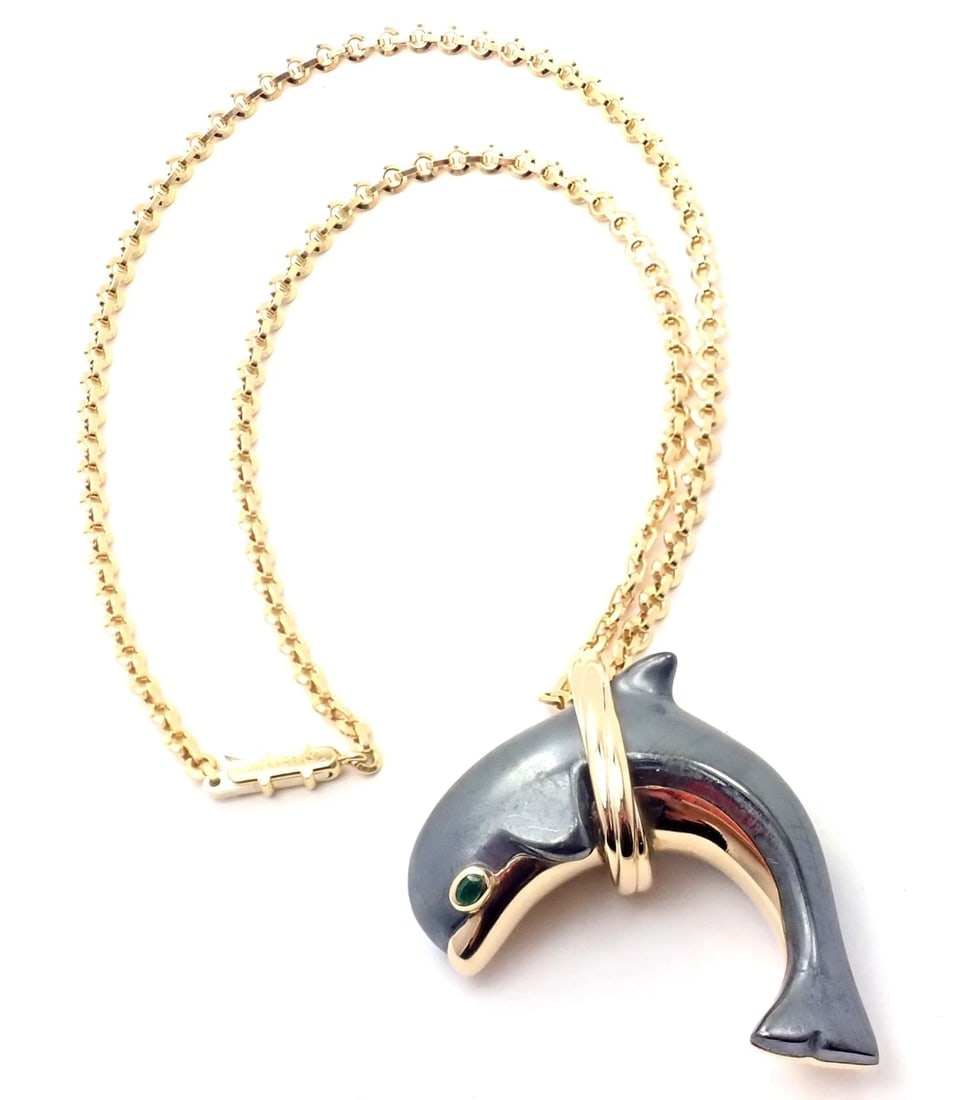 Rare! Authentic Cartier 18k Yellow Gold Hematite Dolphin Pendant Link Necklace: Rare! Authentic Cartier 18k Yellow Gold Hematite Dolphin Pendant Link Necklace About This Piece: Metal: 18k Yellow Gold Measurements: Pendant: 46mm x 32mm Chain: Length: 16.5" Width: 4mm Weight: Chain