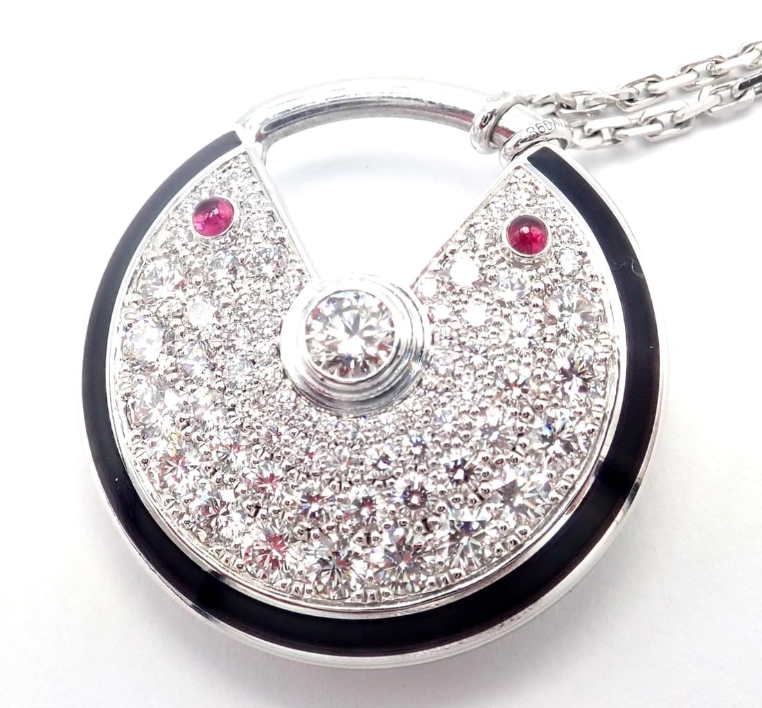 Authentic! Cartier Amulette 18k White Gold Diamond Ruby Large Pendant Necklace: Authentic! Cartier Amulette 18k White Gold Diamond Ruby Large Pendant Necklace About This Piece: About Cartier: The company has a long and distinguished history of serving royalty, as well as stars an