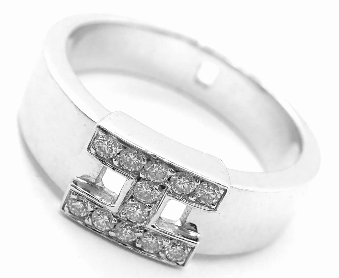 Authentic! Hermes 18k White Gold Diamond H Band Ring: Authentic! Hermes 18k White Gold Diamond H Band Ring About This Piece: Metal: 18k White Gold Size: European 51 US 5 3/4 Weight: 5.8 grams Width: Stones: 7mm 12 round brilliant cut diamonds VS1 clarity