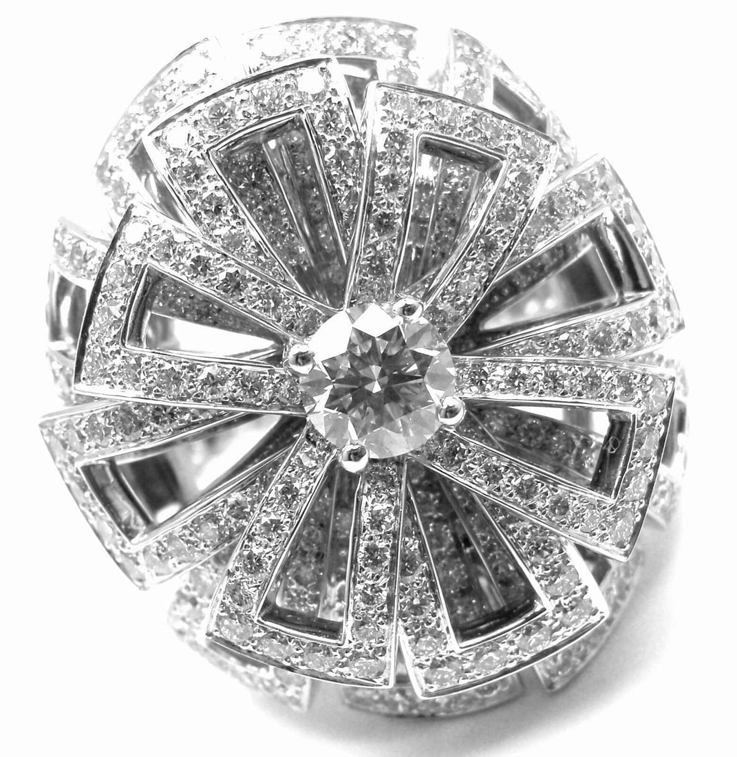 Rare! Authentic Chanel Flower 18k White Gold Diamond Large Ring: Rare! Authentic Chanel Flower 18k White Gold Diamond Large Ring About This Piece: This ring comes with Chanel box and GIA certificate for .50ct diamond in the middle. About CHANEL: One of the most vis
