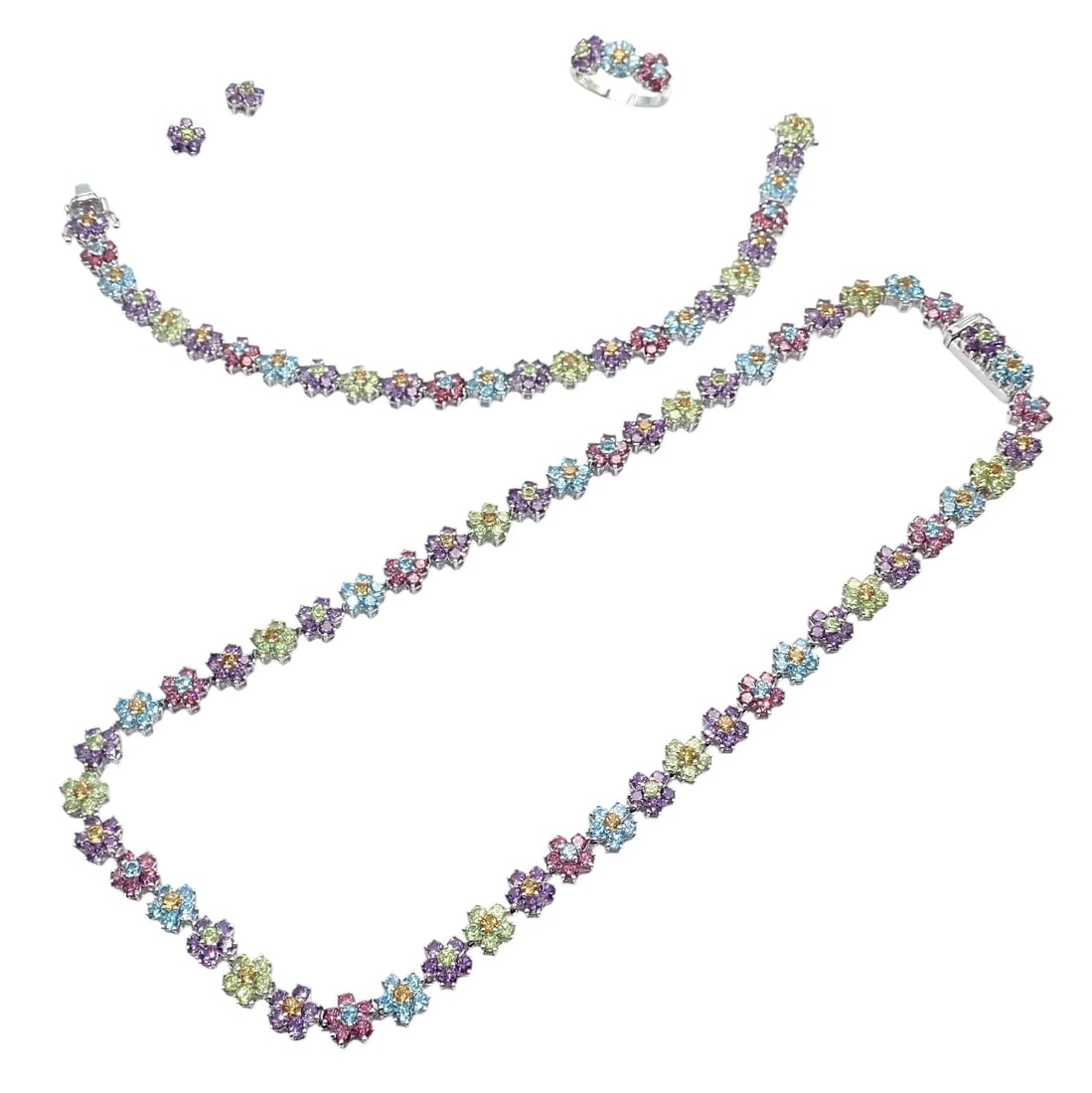 Estate 18k White Gold Color Stone Flower Necklace Ring Bracelet Earrings Set 52g: This estate jewelry set is crafted in 18k white gold, featuring colorful gemstone flowers in a matching necklace, bracelet, ring, and earrings set. Vibrant stones in pastel blue, pink, purple, green, 