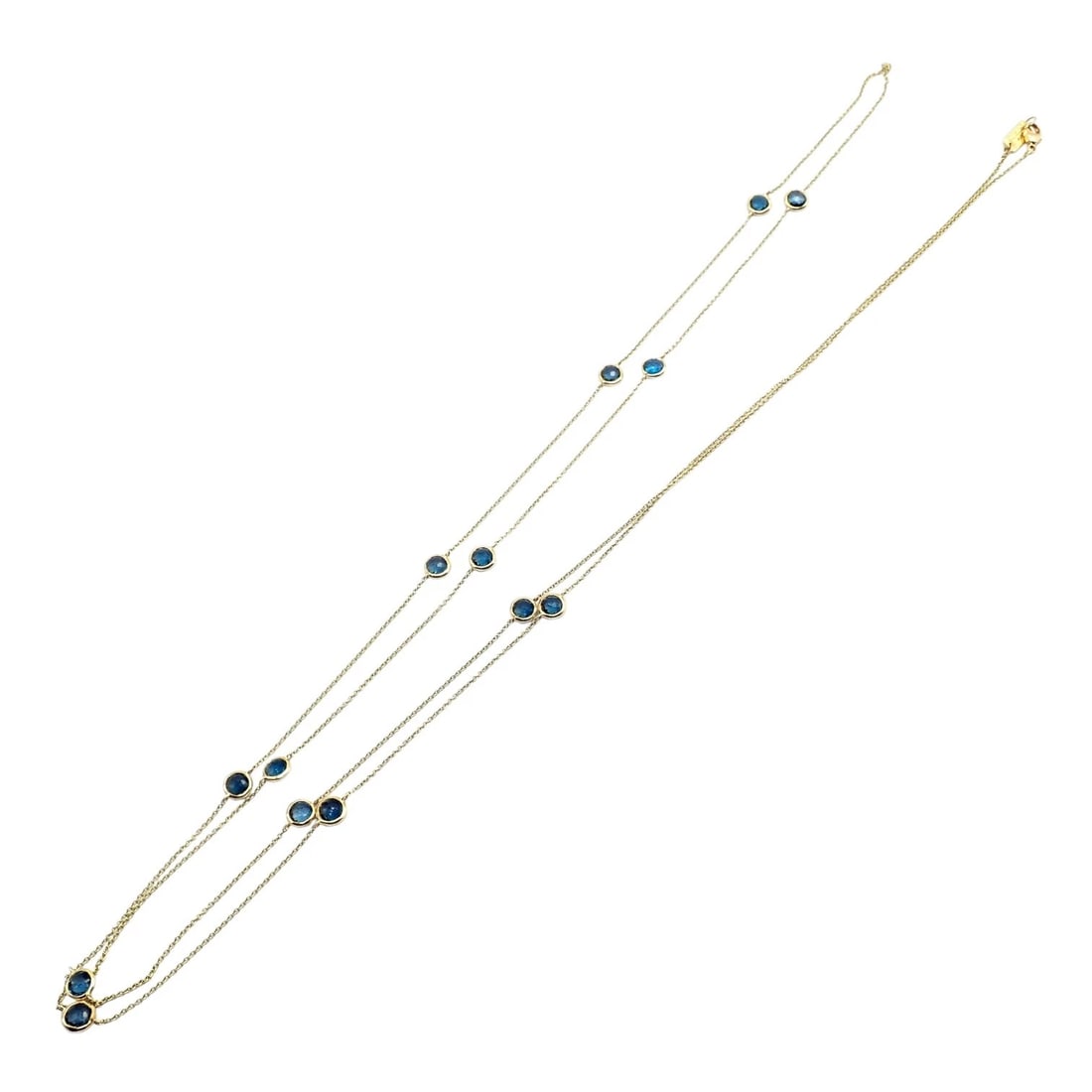 Ippolita 18k Yellow Gold 14 Station Blue Sapphire 48" Long Lollipop Necklace: Ippolita Lollipop necklace crafted in 18k yellow gold, featuring fourteen bezel-set blue sapphire stations on delicate layered chains. Extra-long 48-inch length offers versatile styling: wear doubled,