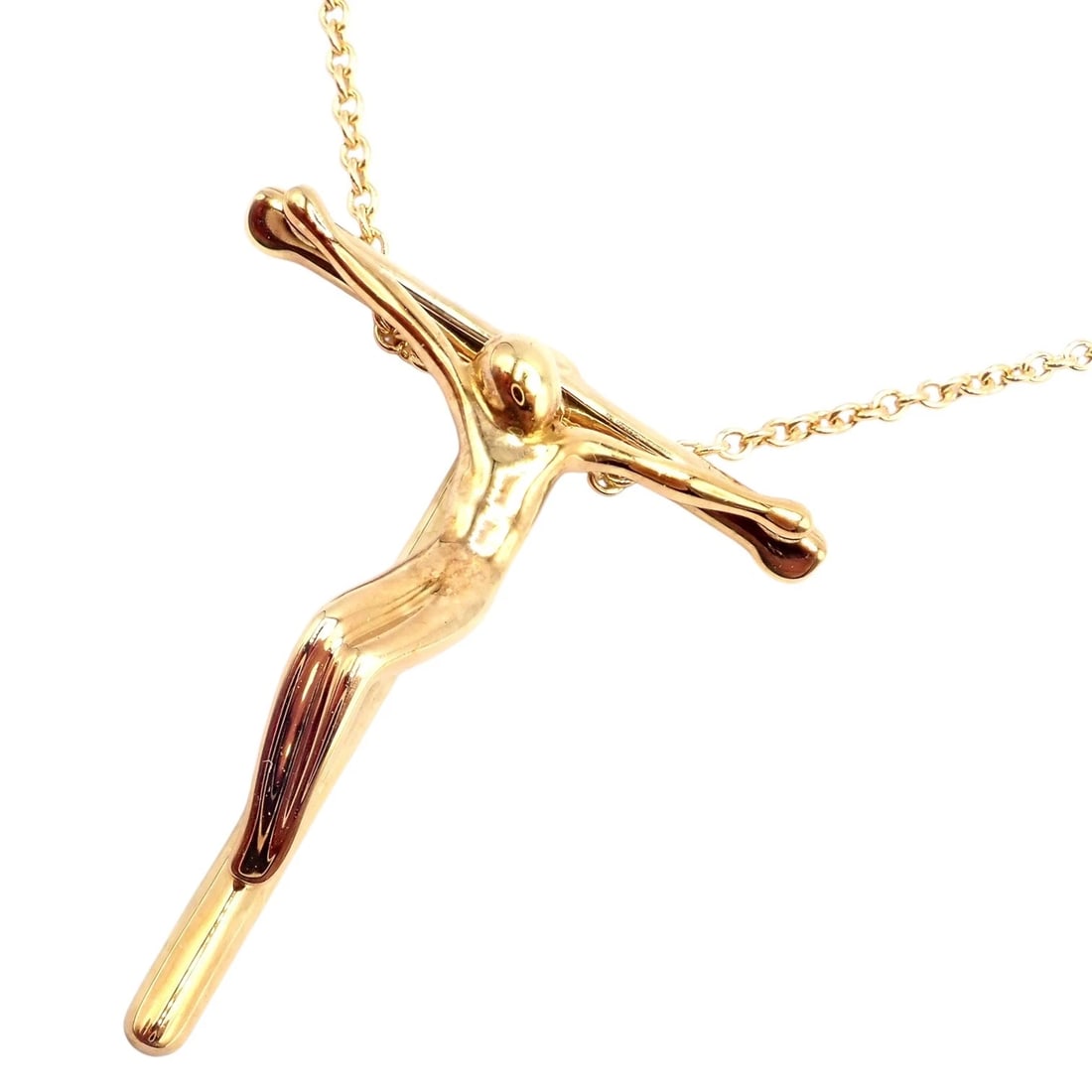 Vintage! Tiffany & Co Peretti 18k Gold Jesus Rosary Cross Pendant Necklace: This vintage Tiffany & Co. Elsa Peretti Cross pendant necklace crafted in luxurious 18k yellow gold. Featuring Peretti’s iconic sculptural crucifix design suspended from a delicate gold chain, t