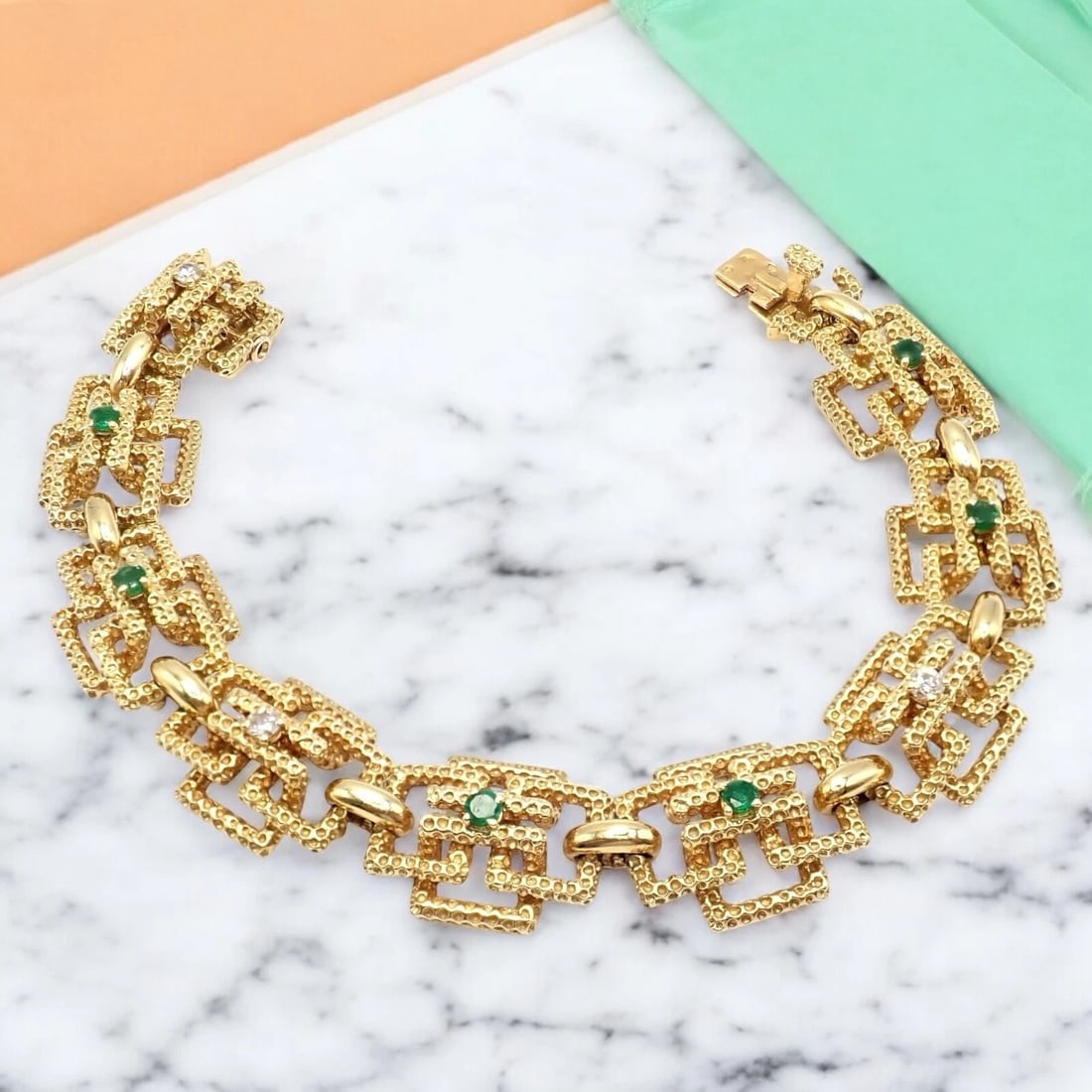Vintage Tiffany & Co France 18k Yellow Gold Diamond Emerald Bracelet: A testament to timeless elegance, this Vintage Tiffany & Co France 18k Yellow Gold Diamond Emerald Bracelet showcases exquisite craftsmanship. Crafted from radiant 18k gold, it sparkles with brilliant